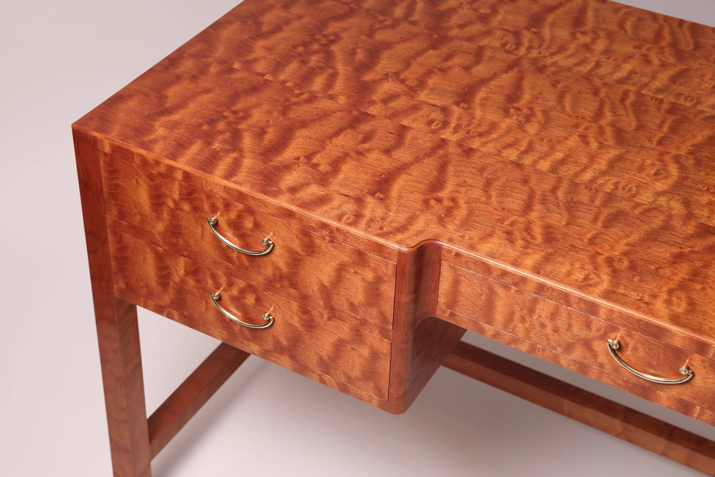 Detail showing Josef Frank style mid-century modern custom made desk incorporating highly figured curly mahogany.