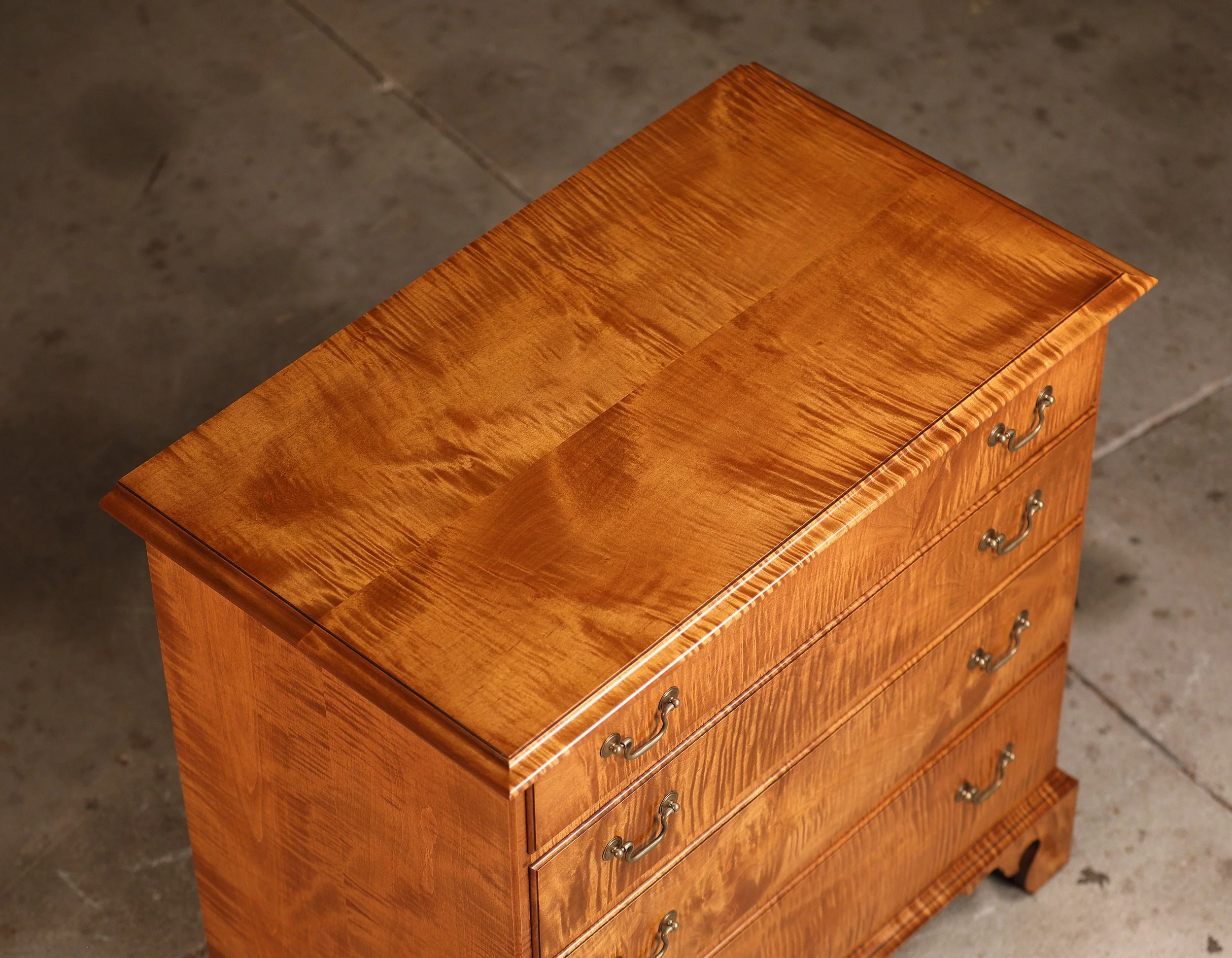 Tiger maple Queen Anne low chest for sale. Top detail.