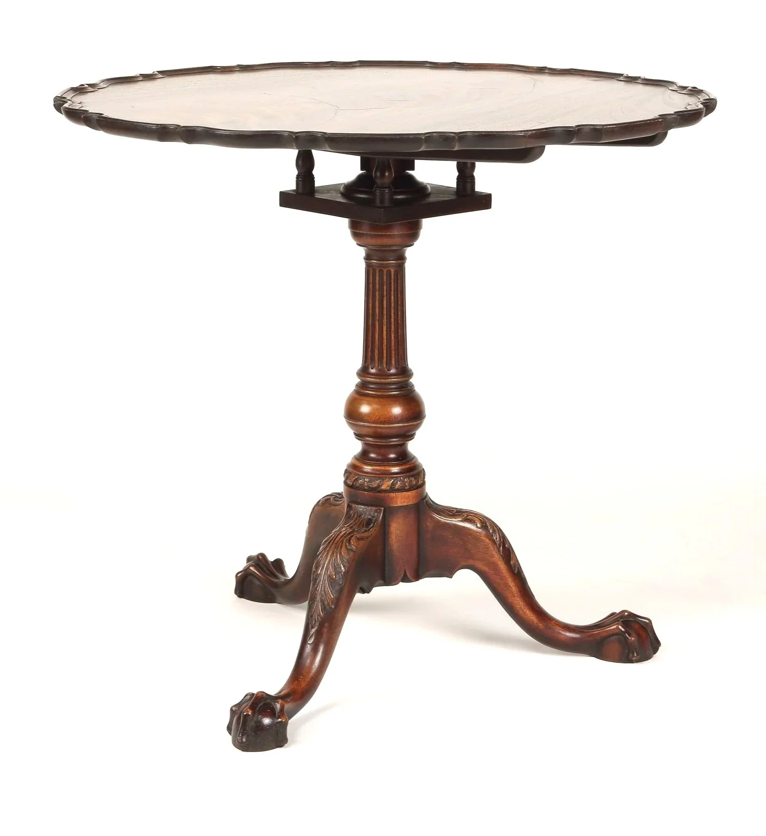 Philadelphia piecrust tea table in mahogany, featuring a 31" diameter single board crotch top with an aged finish.