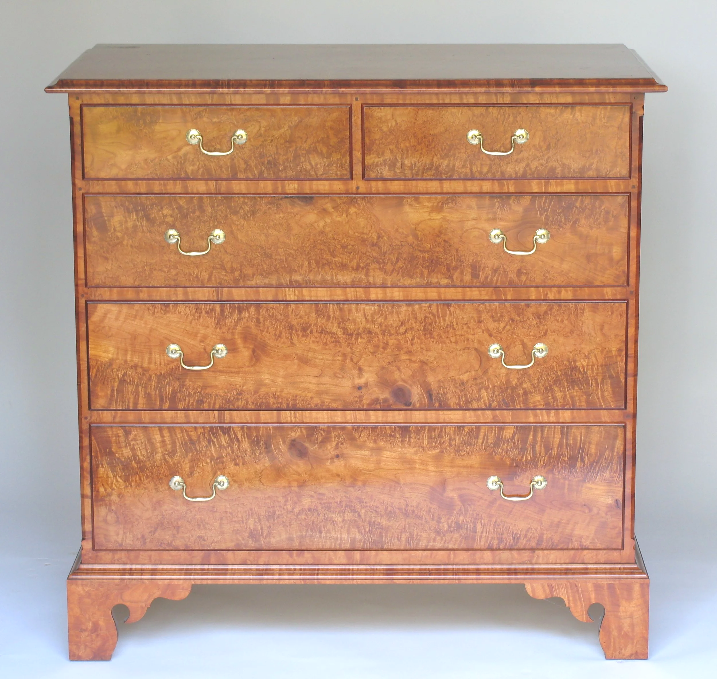 Handcrafted Queen Anne low chest, figured ornamental cherry, split top drawer, hand cut dovetailed case and drawers.
