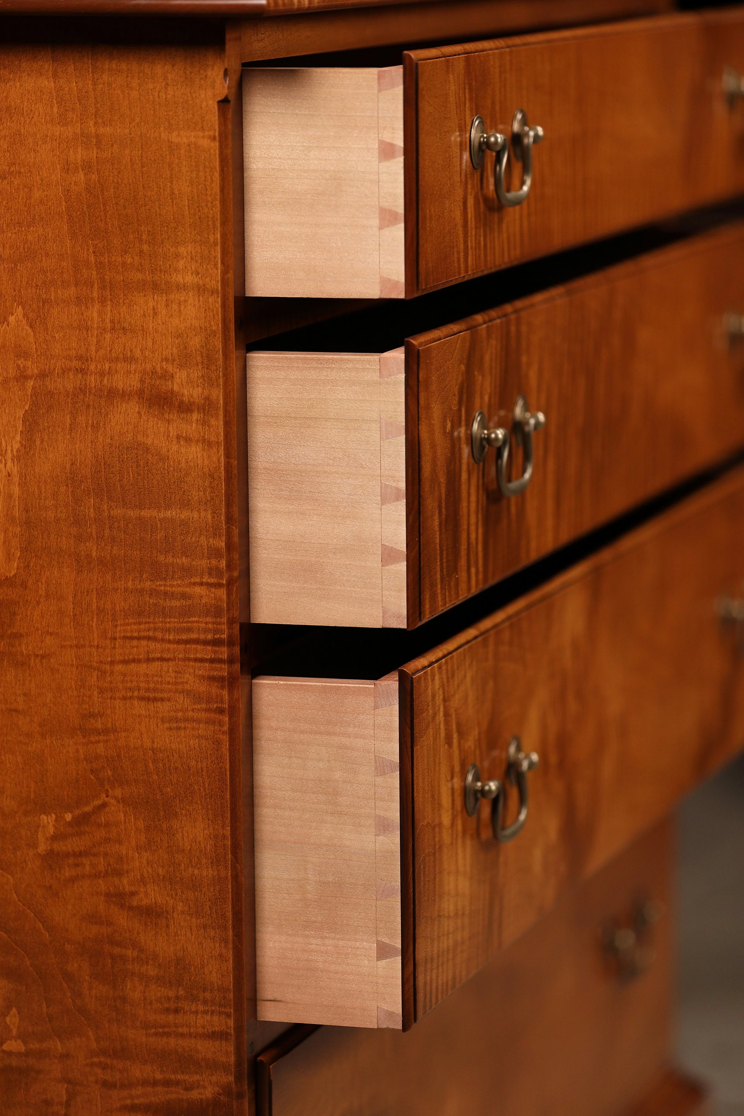 Tiger maple Queen Anne dresser for sale. Hand cut dovetailed drawer detail.