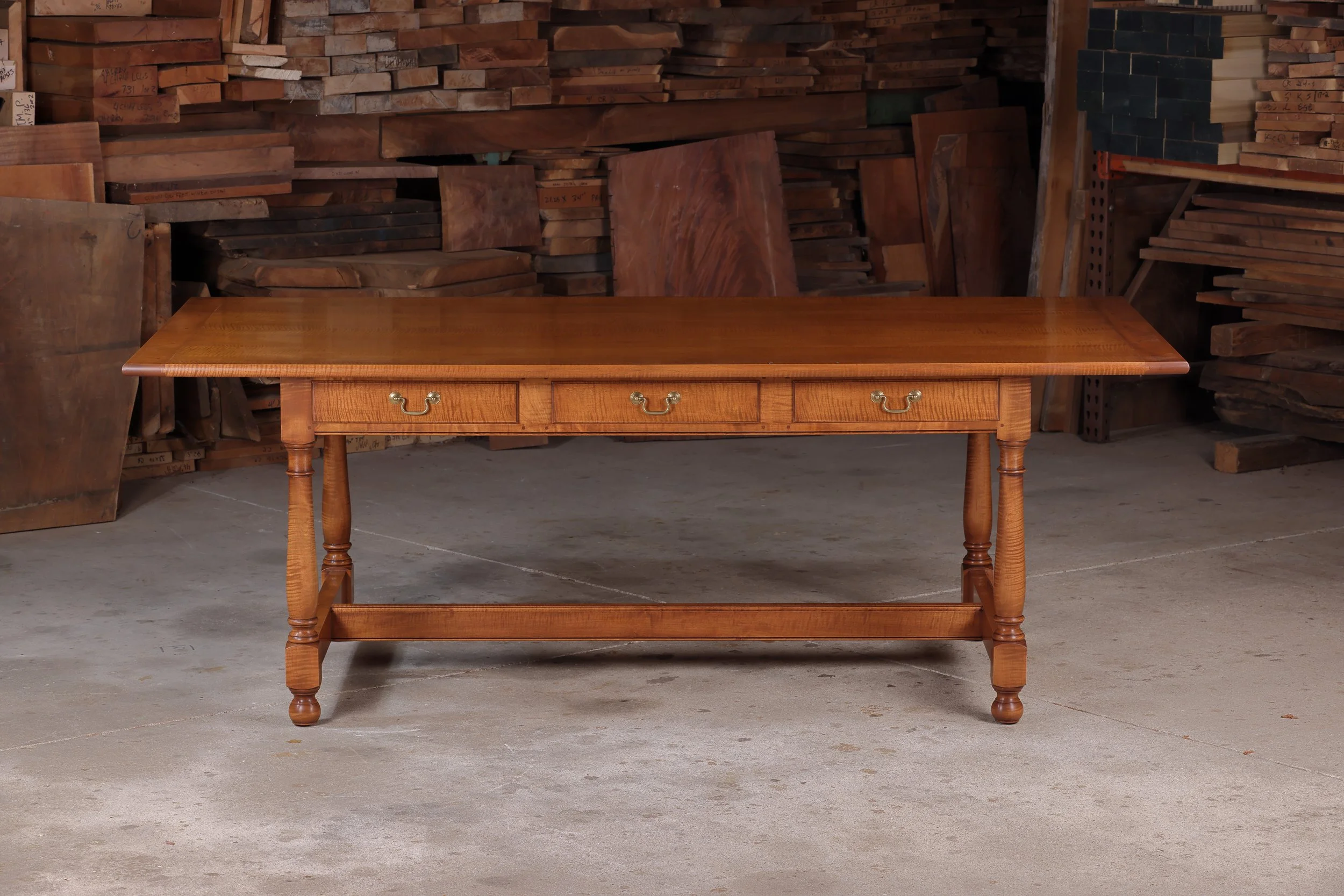 Handcrafted tiger maple tavern table for sale, long wooden dining table, hand turned legs, lacquer finish.