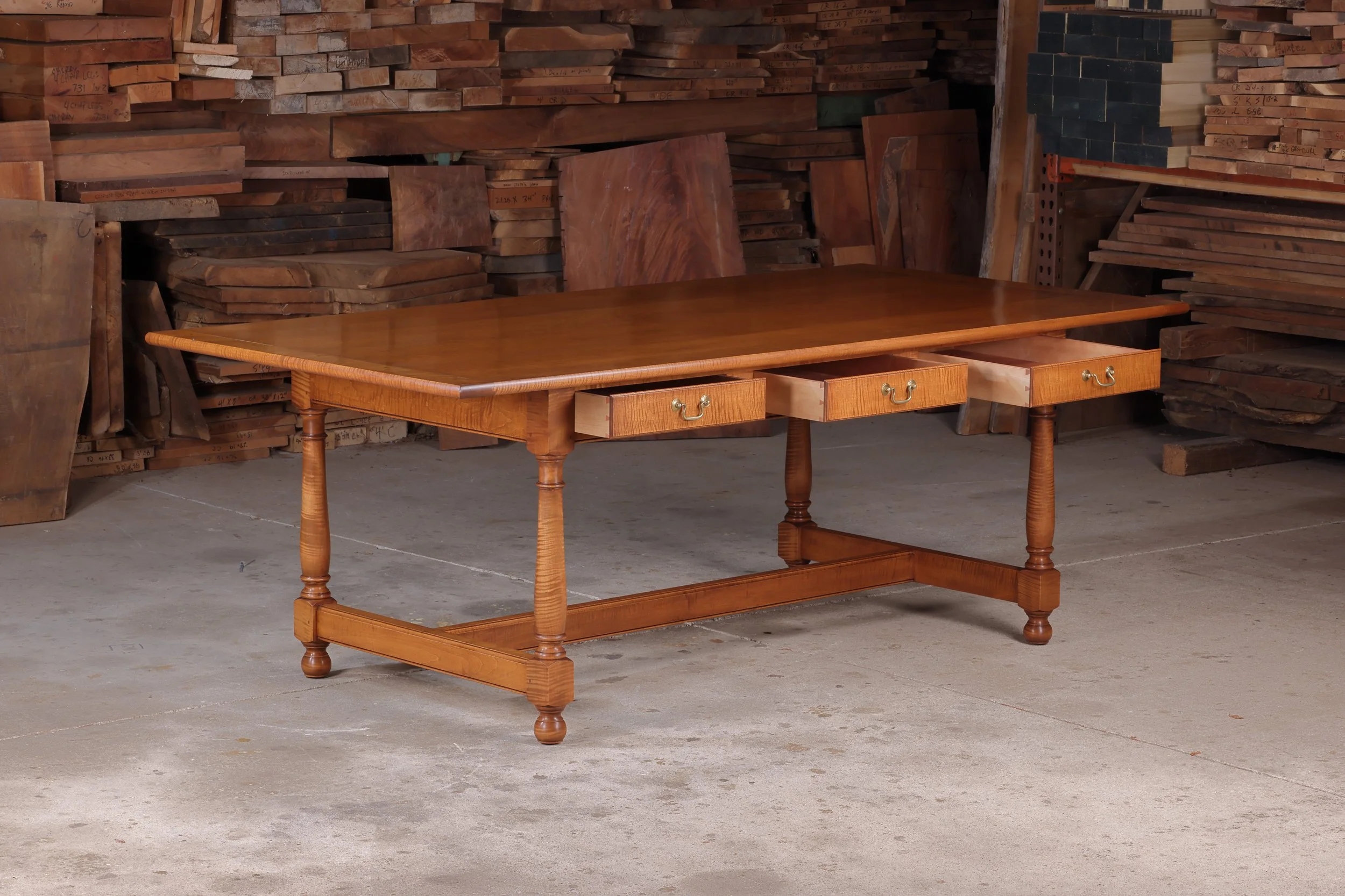 Bespoke tavern table framework highlighting pegged mortise and tenon joinery and hand cut dovetail drawers.