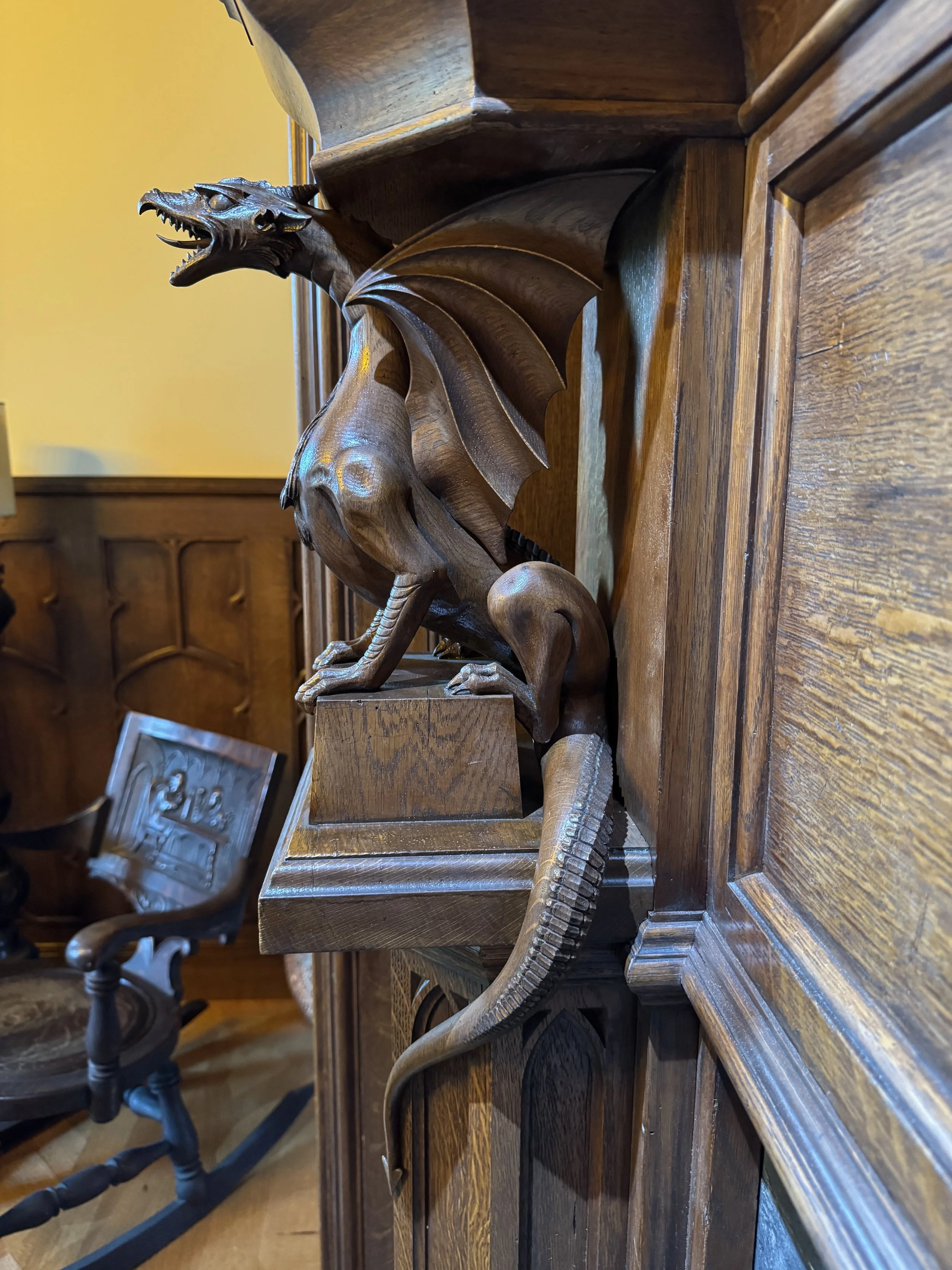 Quarter sawn white oak fireplace mantle, hand carved dragons with an antiqued shellac finish by Benjamin Parry Studios.