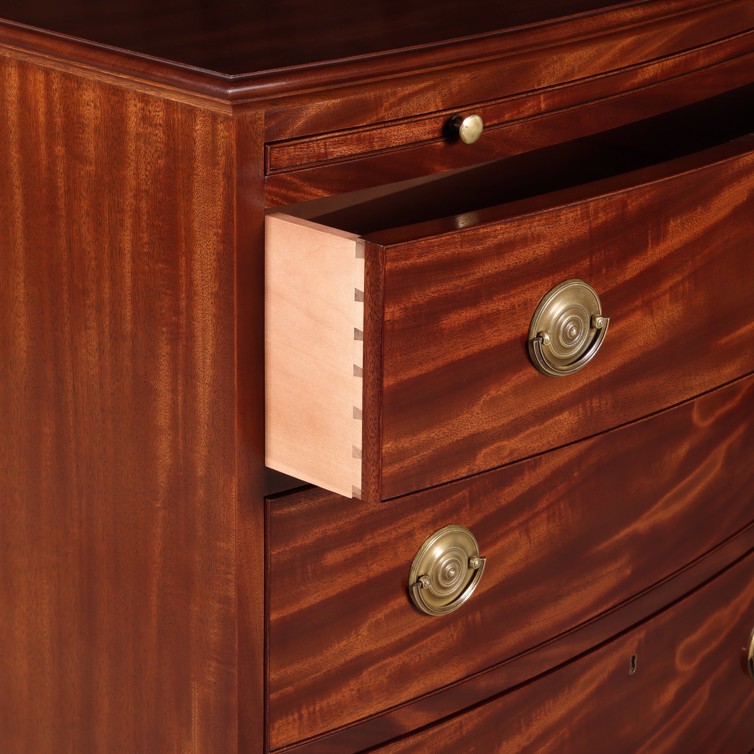 Benchmade Bow Front Chest. Hand cut dovetailed drawers with cock beading.