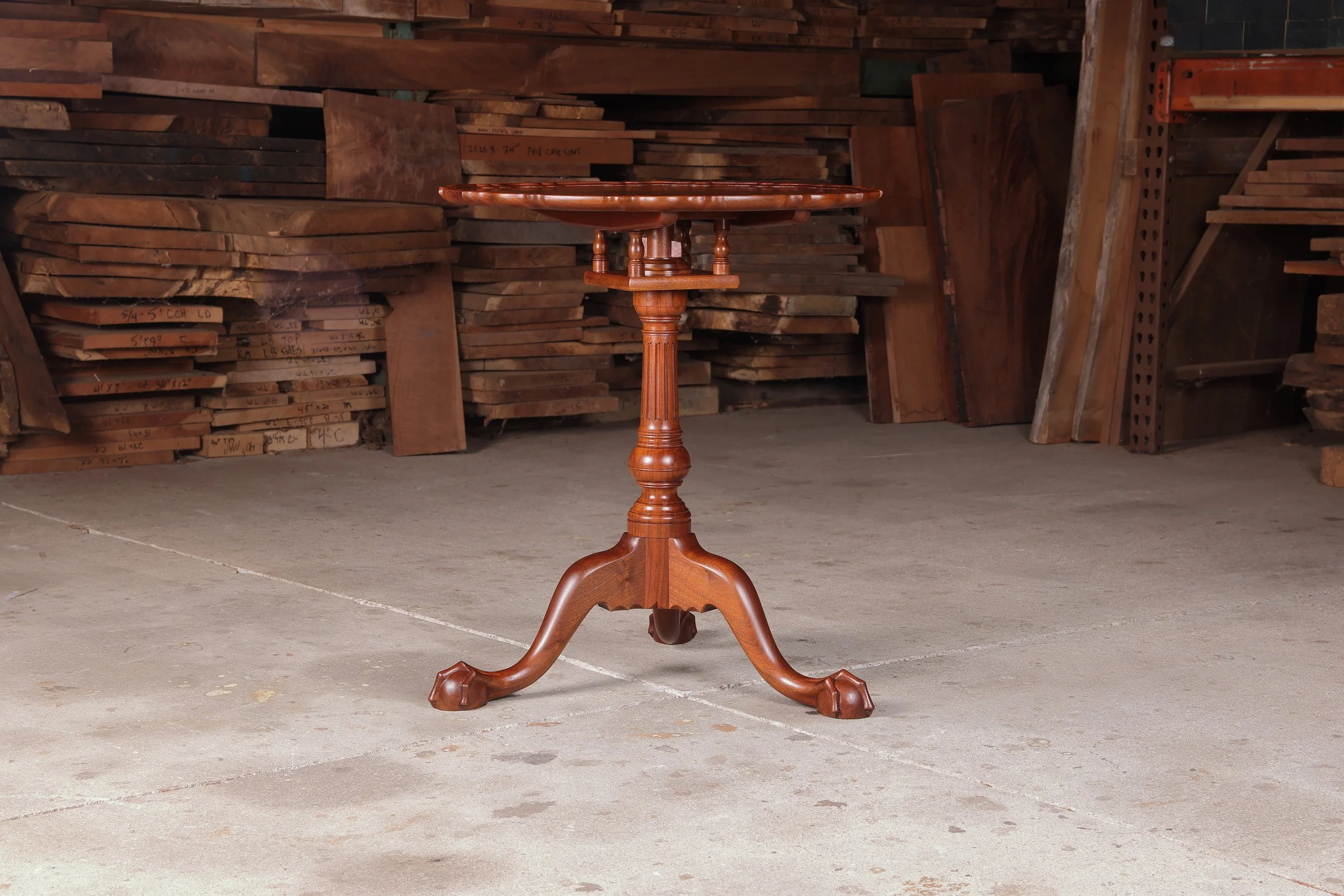 Irion Company walnut piecrust tea table. Side two condition photo.