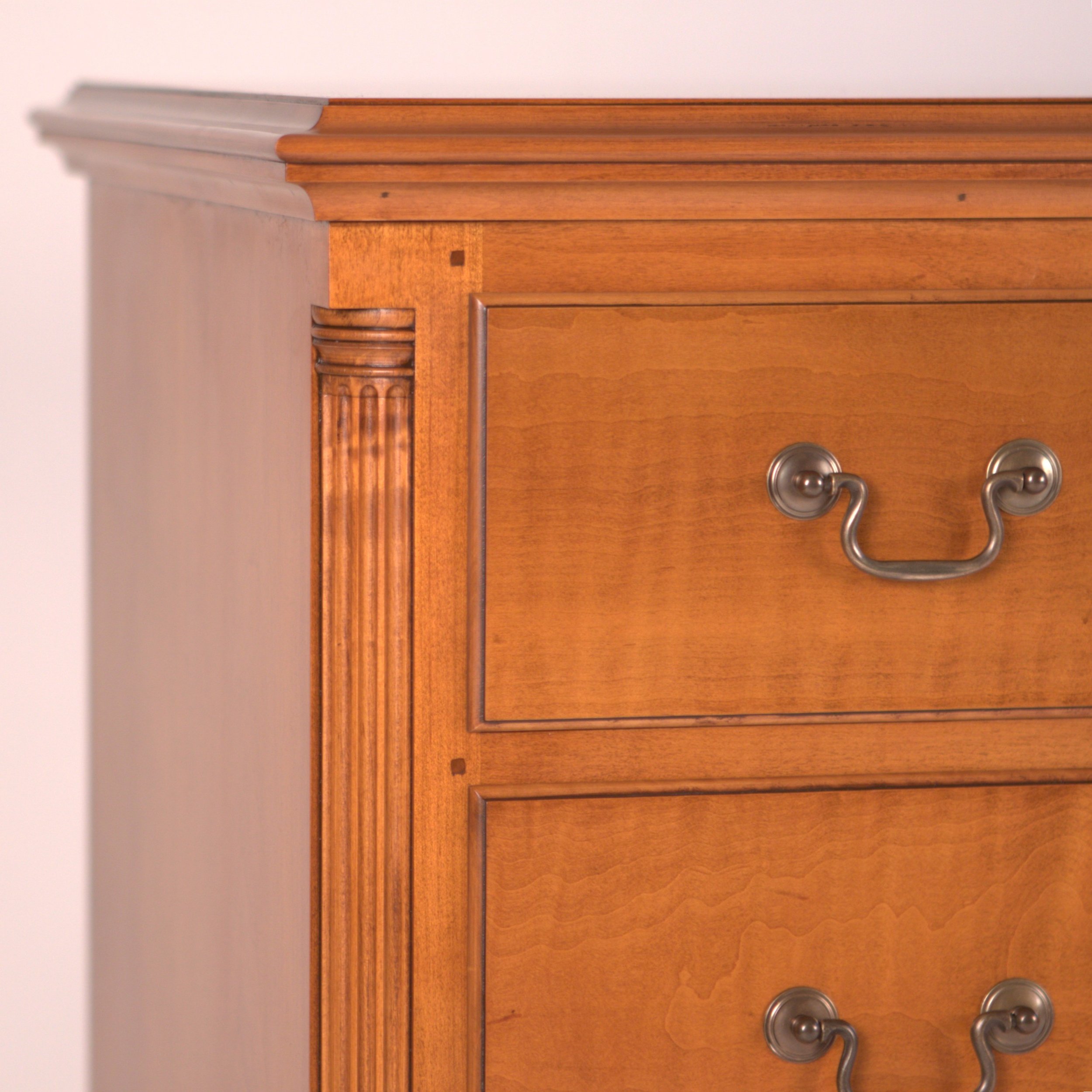 Benchmade Chippendale Double Dresser. Detail of tiger maple drawer fronts, quarter columns, molded lipped edges, solid brass bail and rosette drawer pulls and hand rubbed shellac finish.