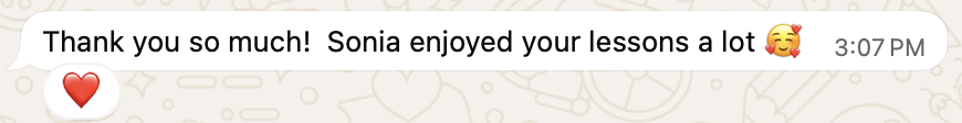 Screenshot of a chat message with a red heart emoji and a smiling face with hearts emoji