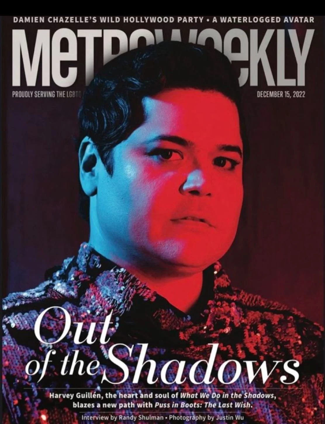 Cover of Metroweekly magazine featuring Harvey Guillén in colorful lighting, with the headline 'Out of the Shadows' about his role in "What We Do in the Shadows." toronto celebrity makeup artist alba feinaj red carpet glam mens grooming