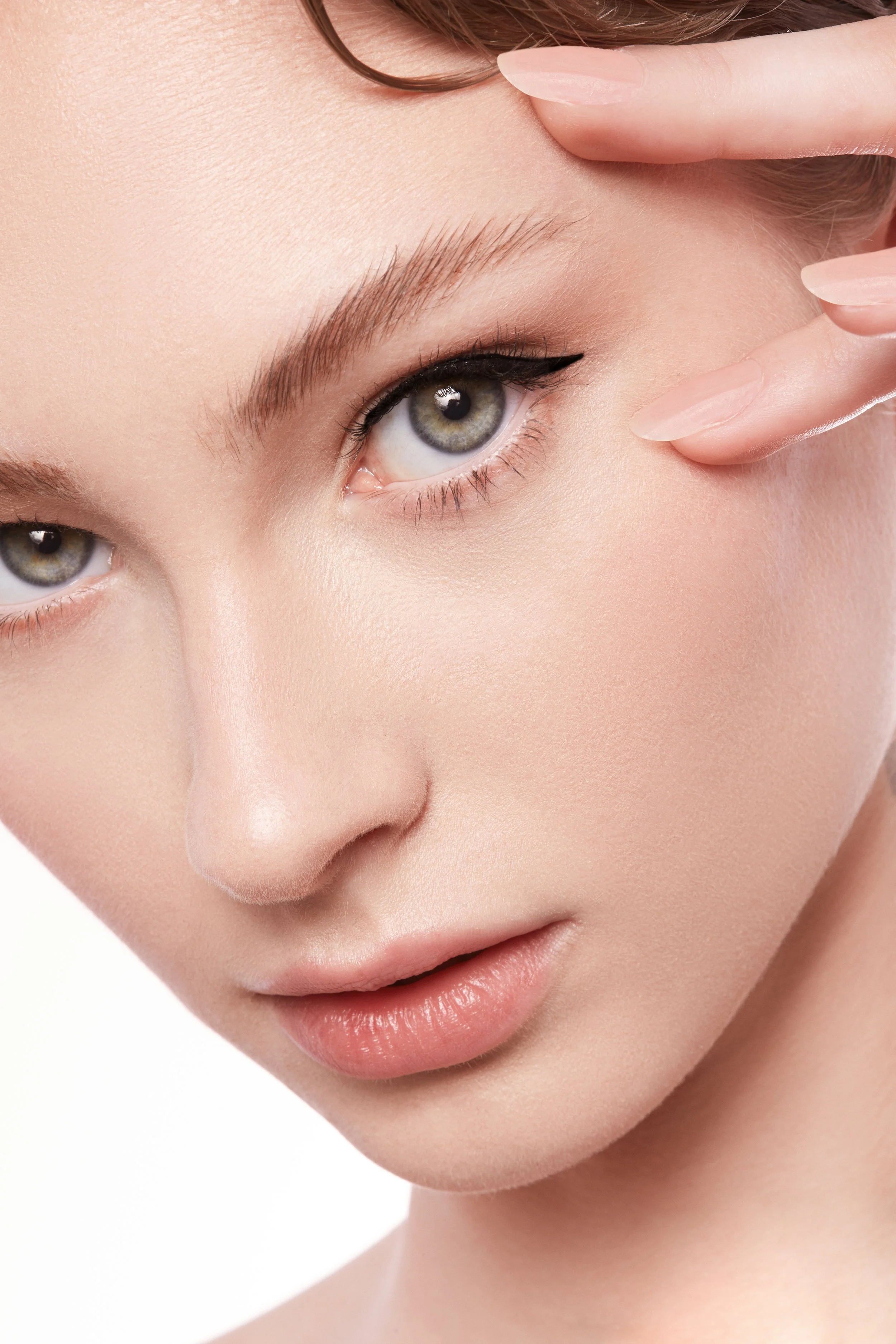 Close-up of a woman's face, blue eyes, natural lips, 
Beauty campaign polished skin, eyeliner, sharp, soft, cute, no makeup makeup, commercial skincare, clean, sustainable 2026 2027 bride toronto