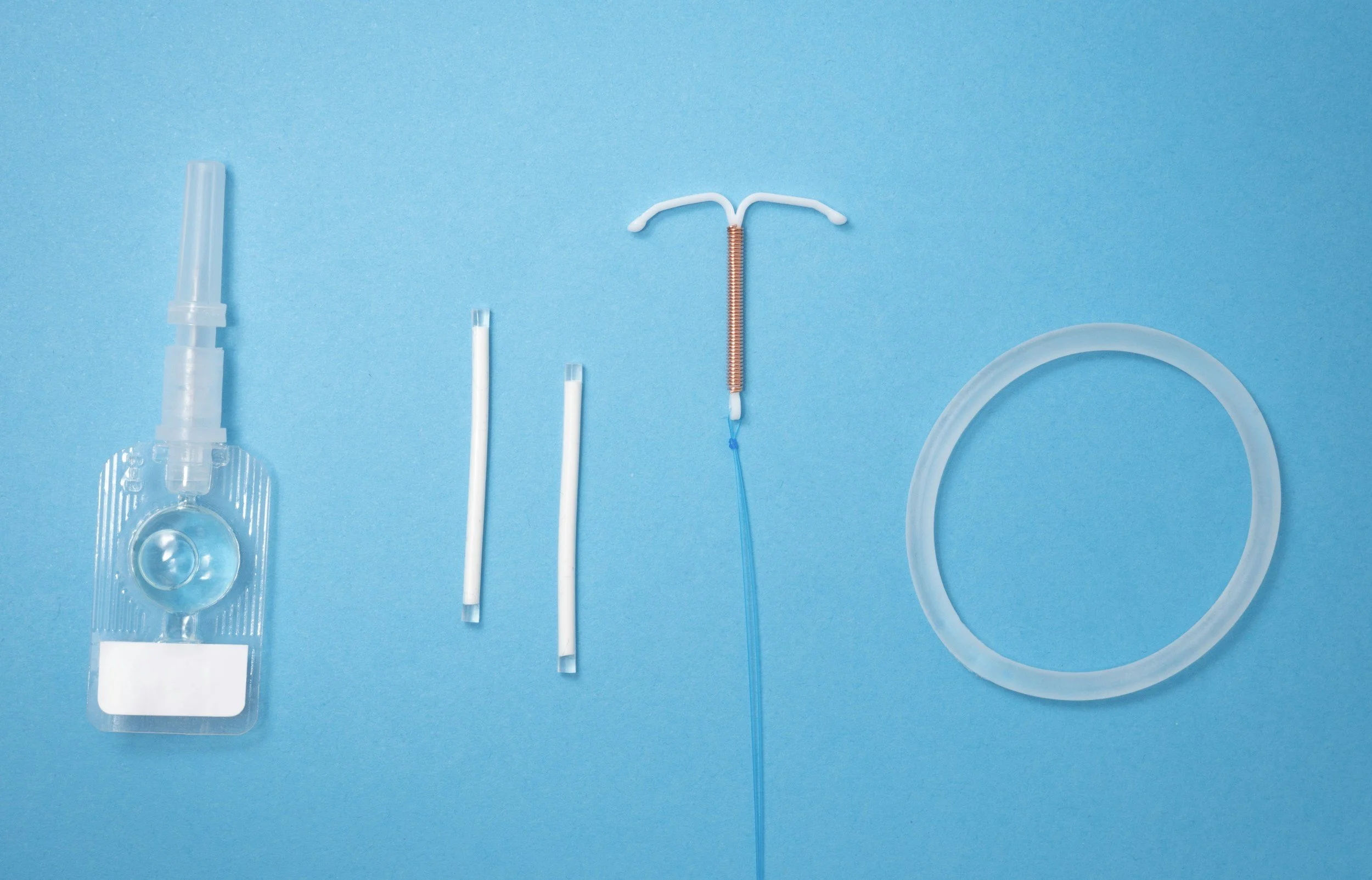 A detailed grayscale digital drawing of a woman's face surrounded by various mechanical and organic objects, creating an intricate and artistic composition.