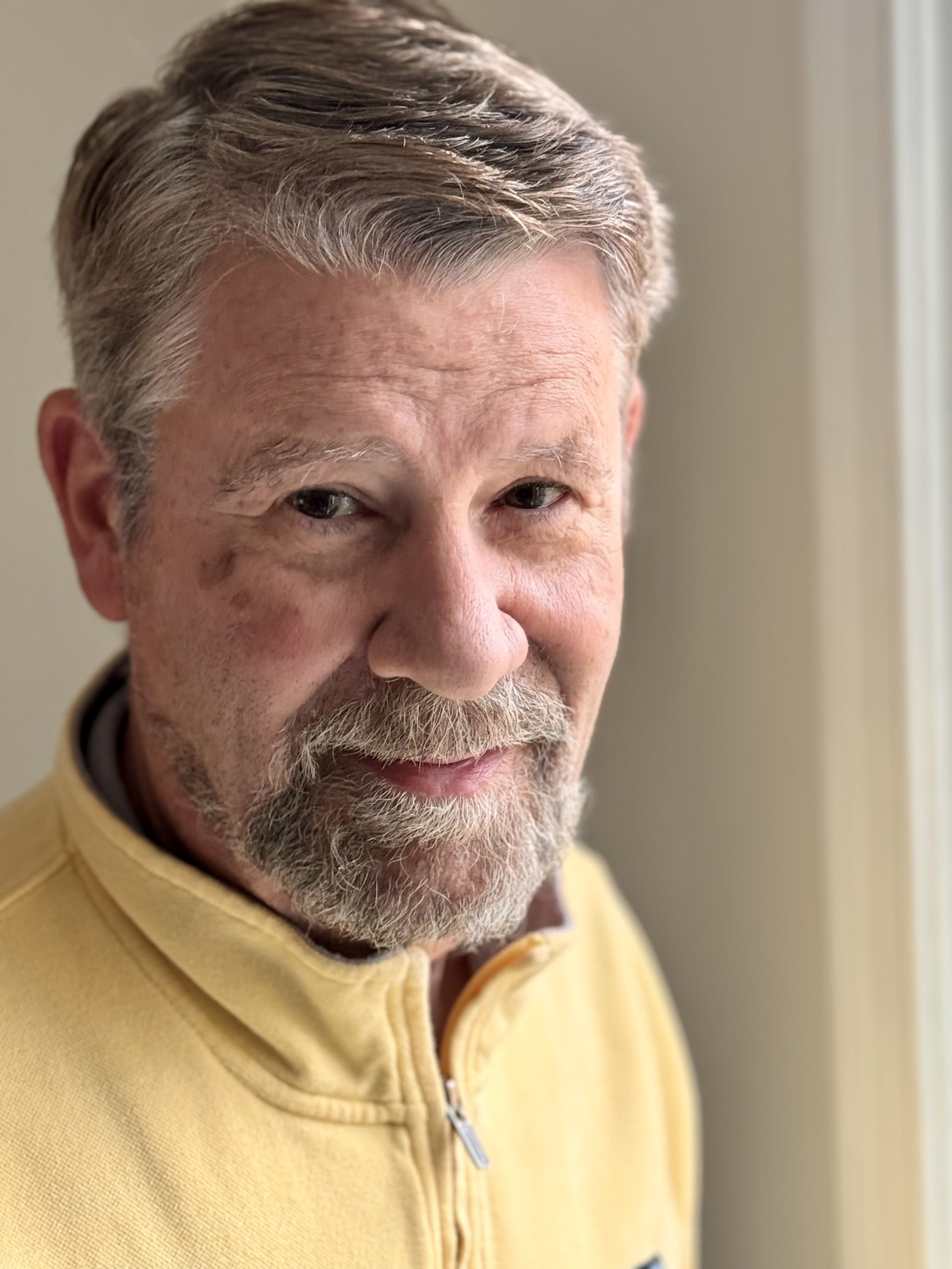 A photo of Guy Woodruff smiling.