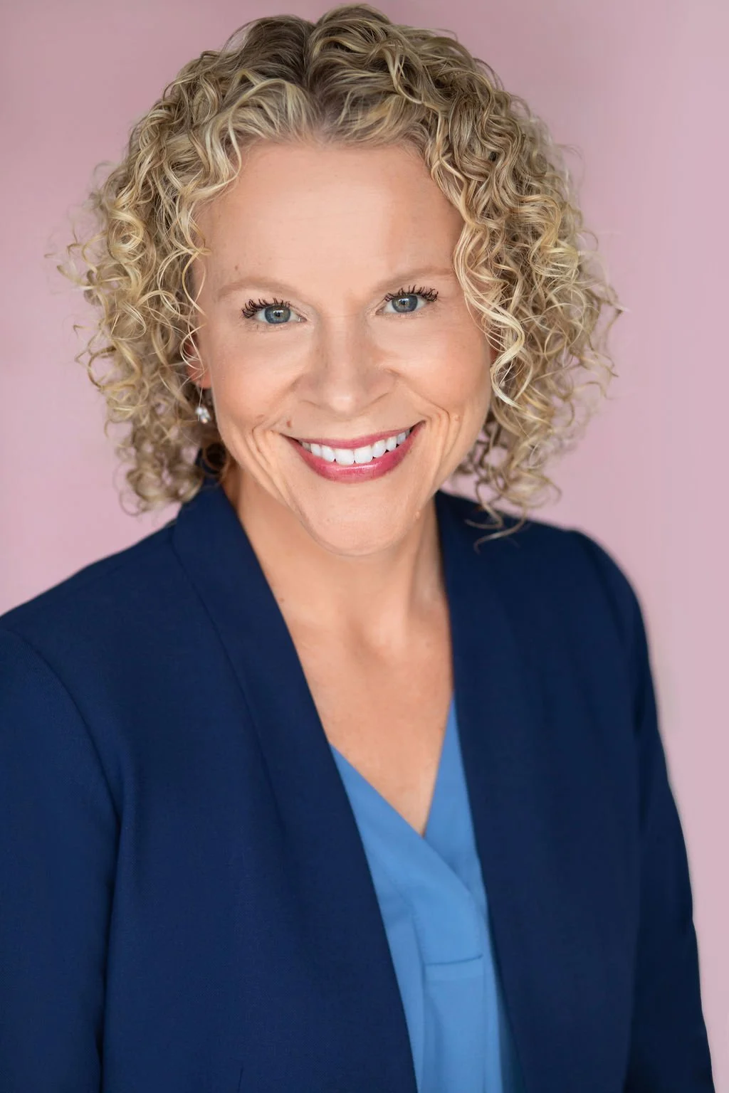 A photo of Alicia MacIntire smiling.