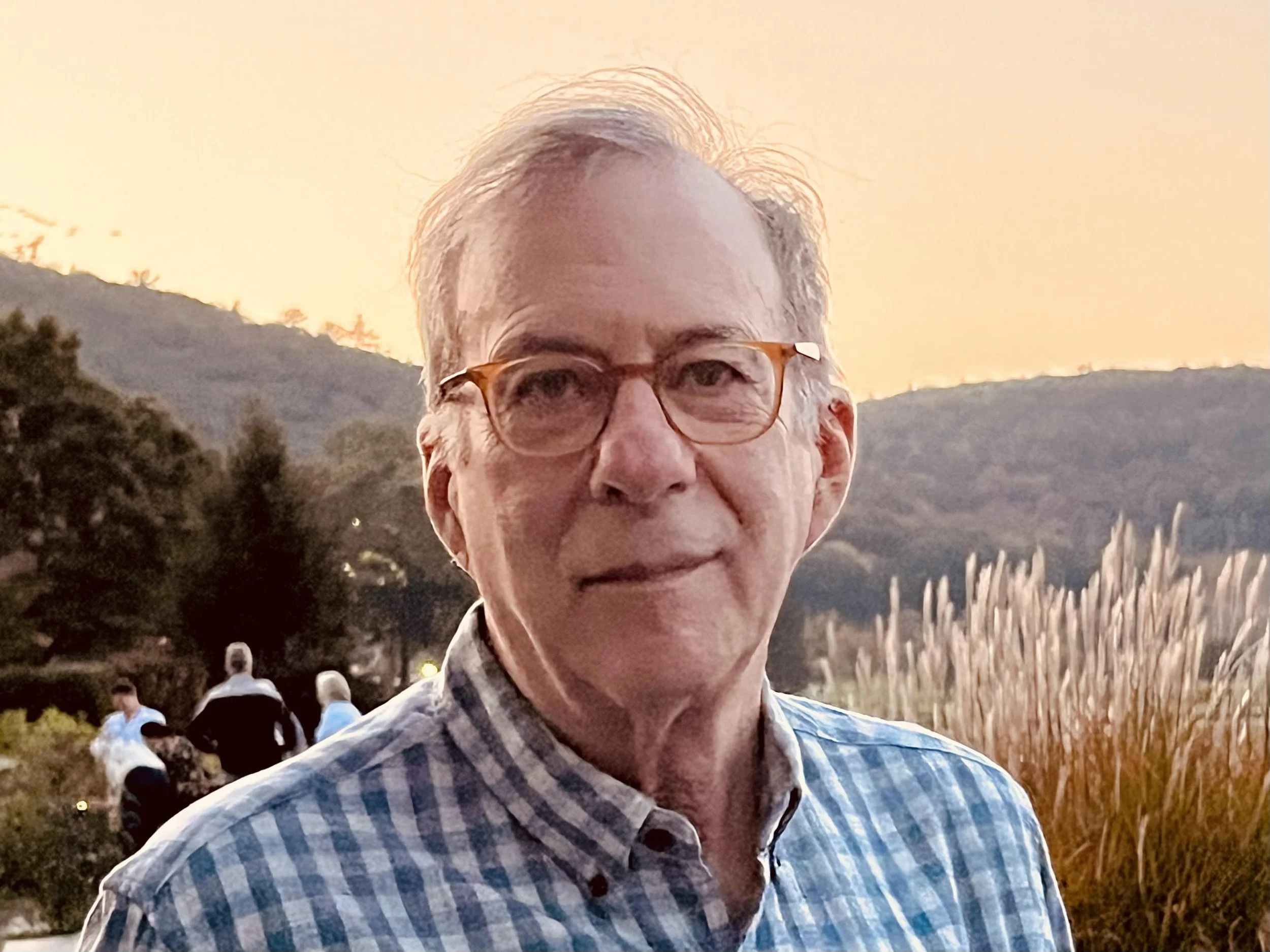 A photo of David smiling at the camera.