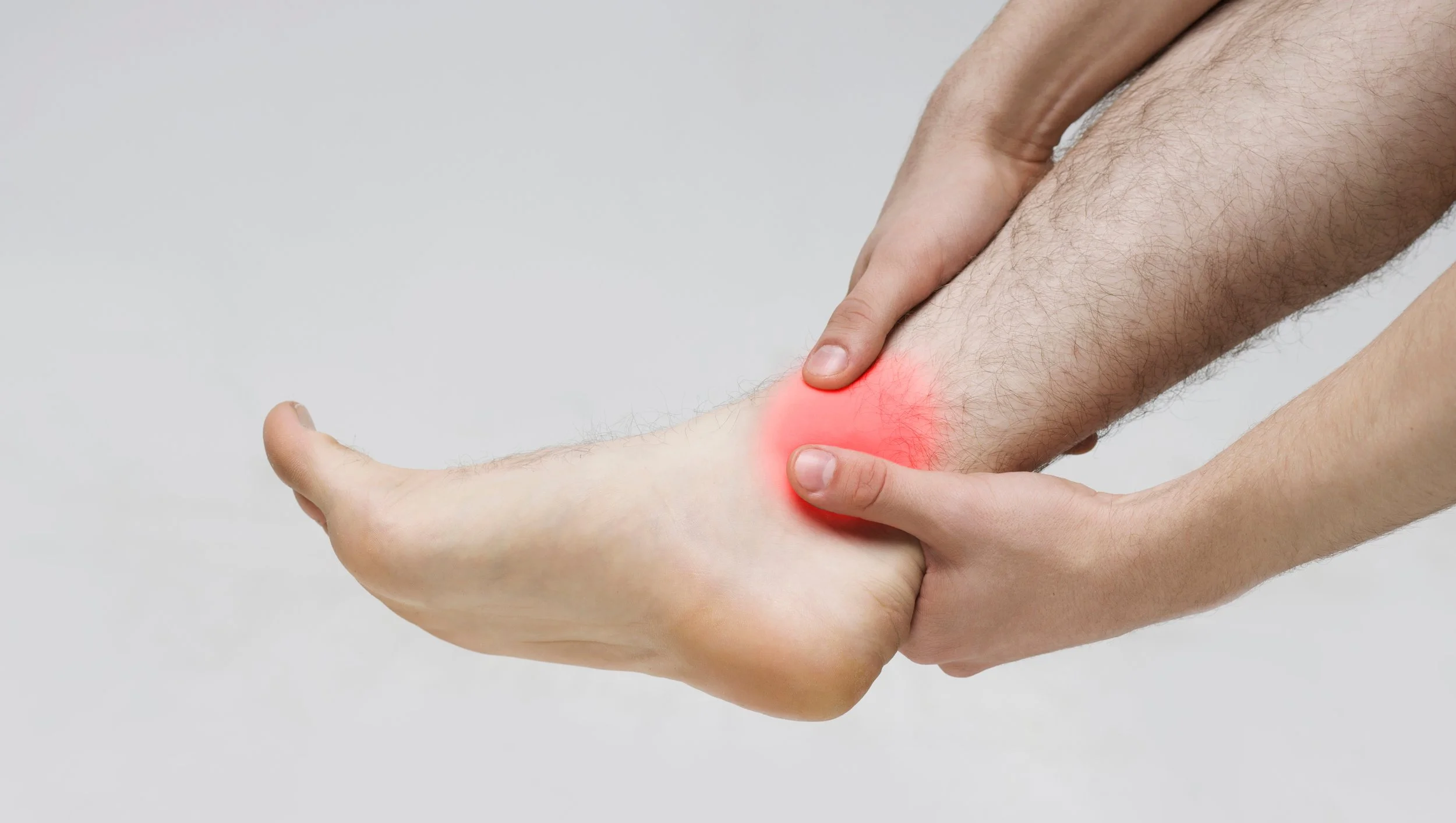 Man hand massaging his leg pain because of twisted ankle and overall ankle instability