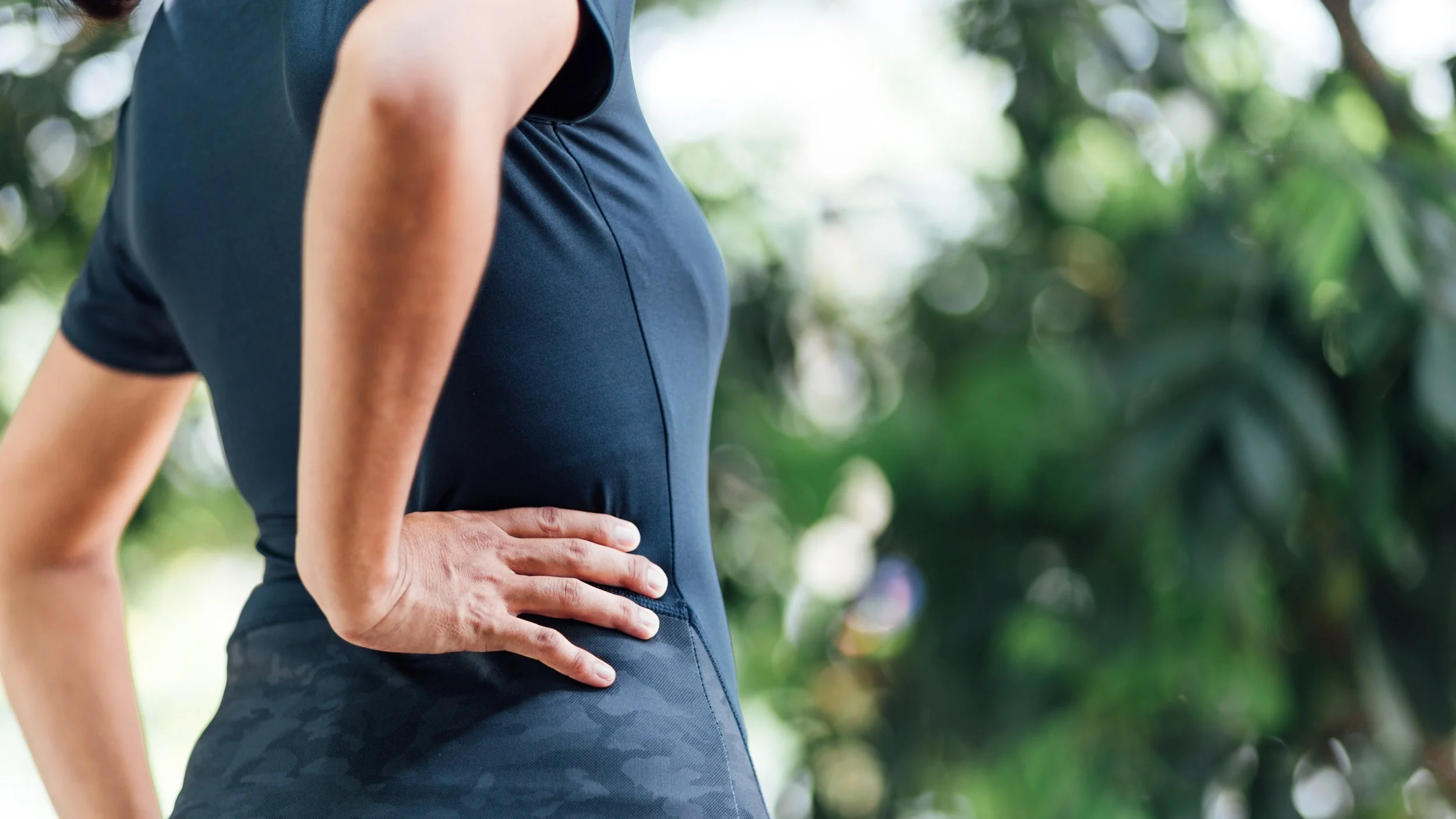 young woman with hip and back pain, health care concept