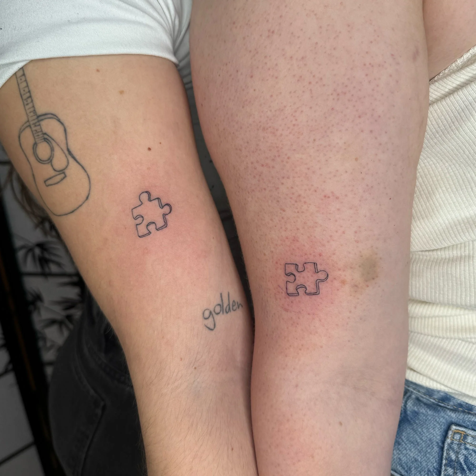 fineline-matching-puzzle-pieces-tattoo.jpg