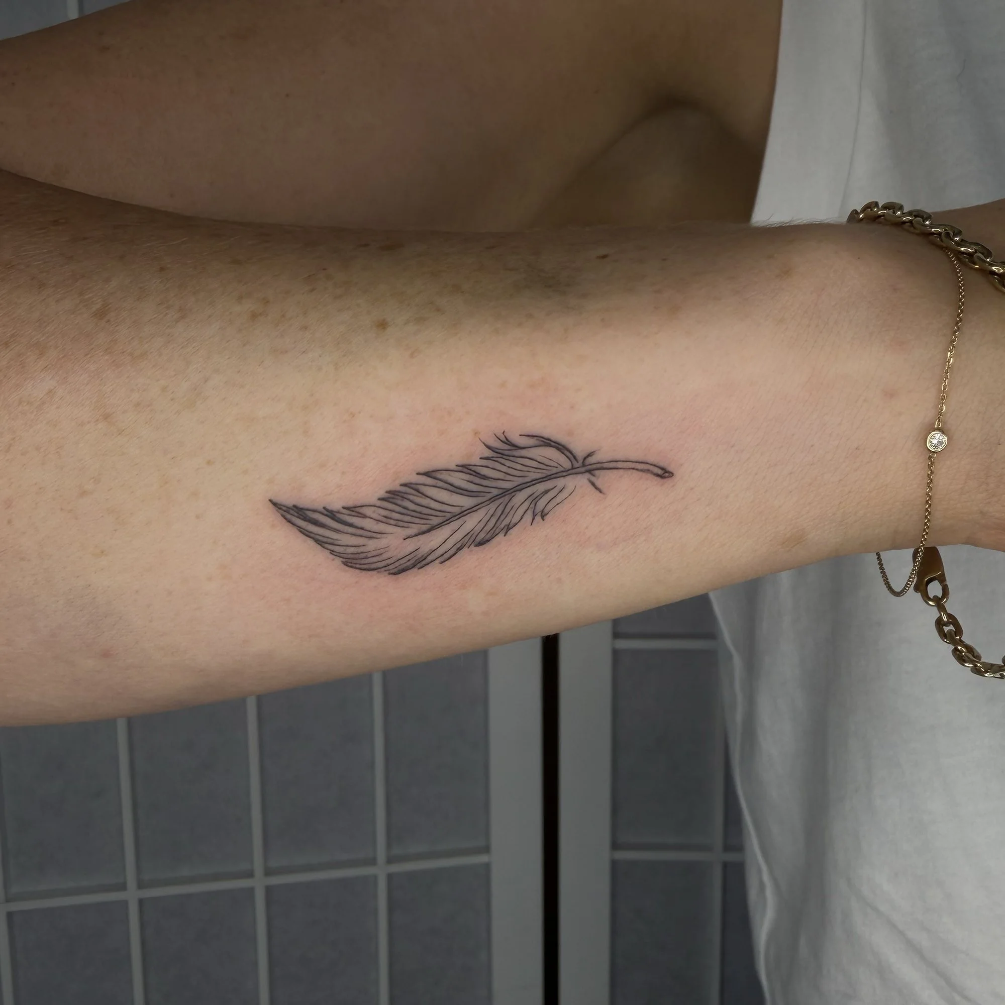 Fineline-feather-forearm-pinterest-tattoo.jpg