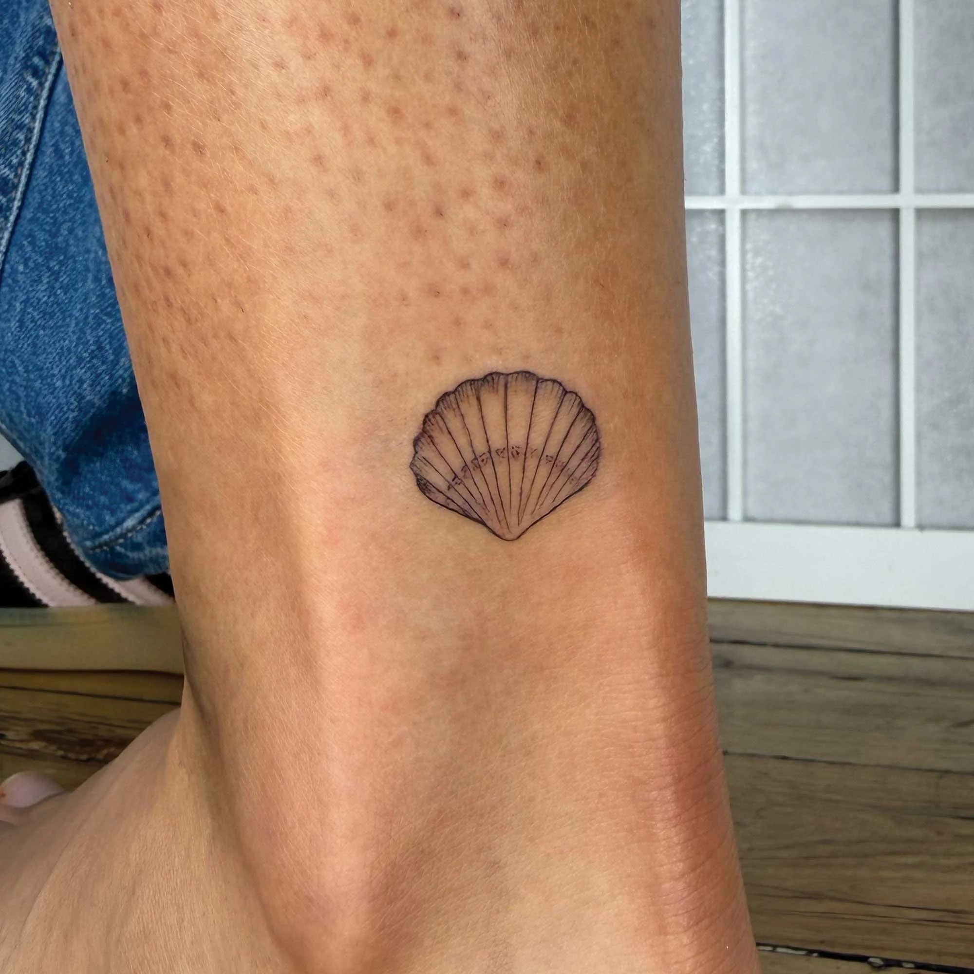 Fineline shell tattoo 