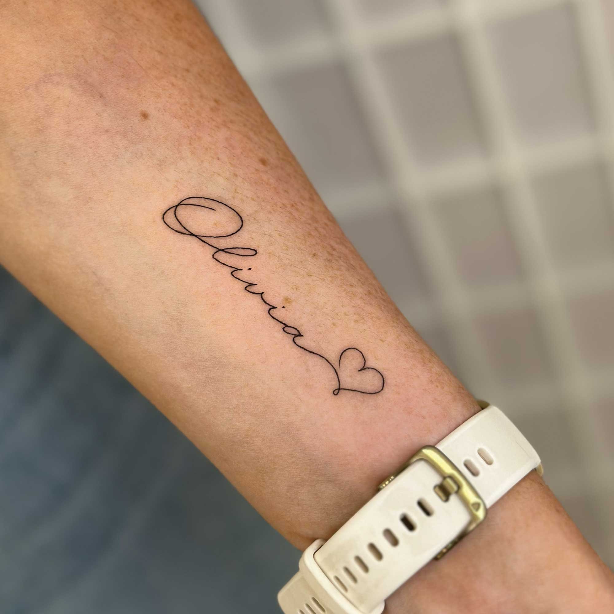 fine line script tattoo 