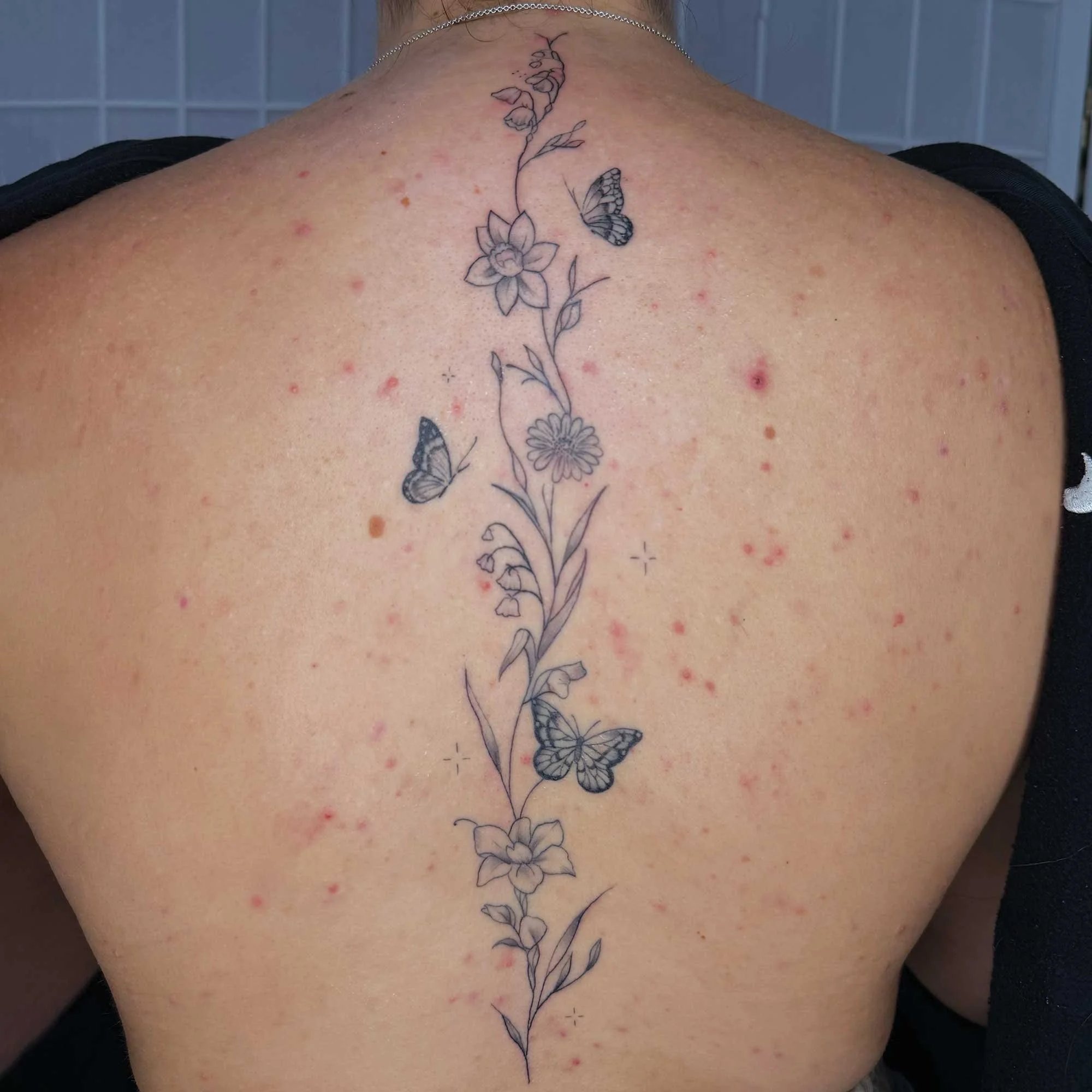 fineline spine tattoo by Bondi fineline tattoo 