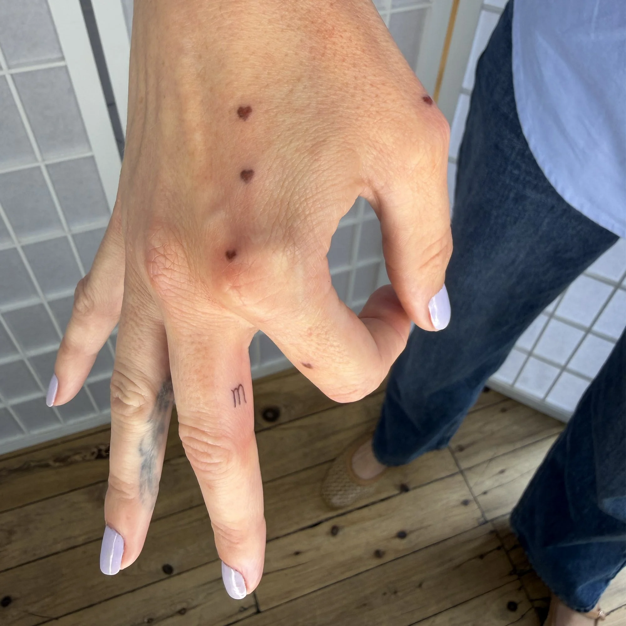 Fineline-brown-heart-freckle-tattoo.jpg