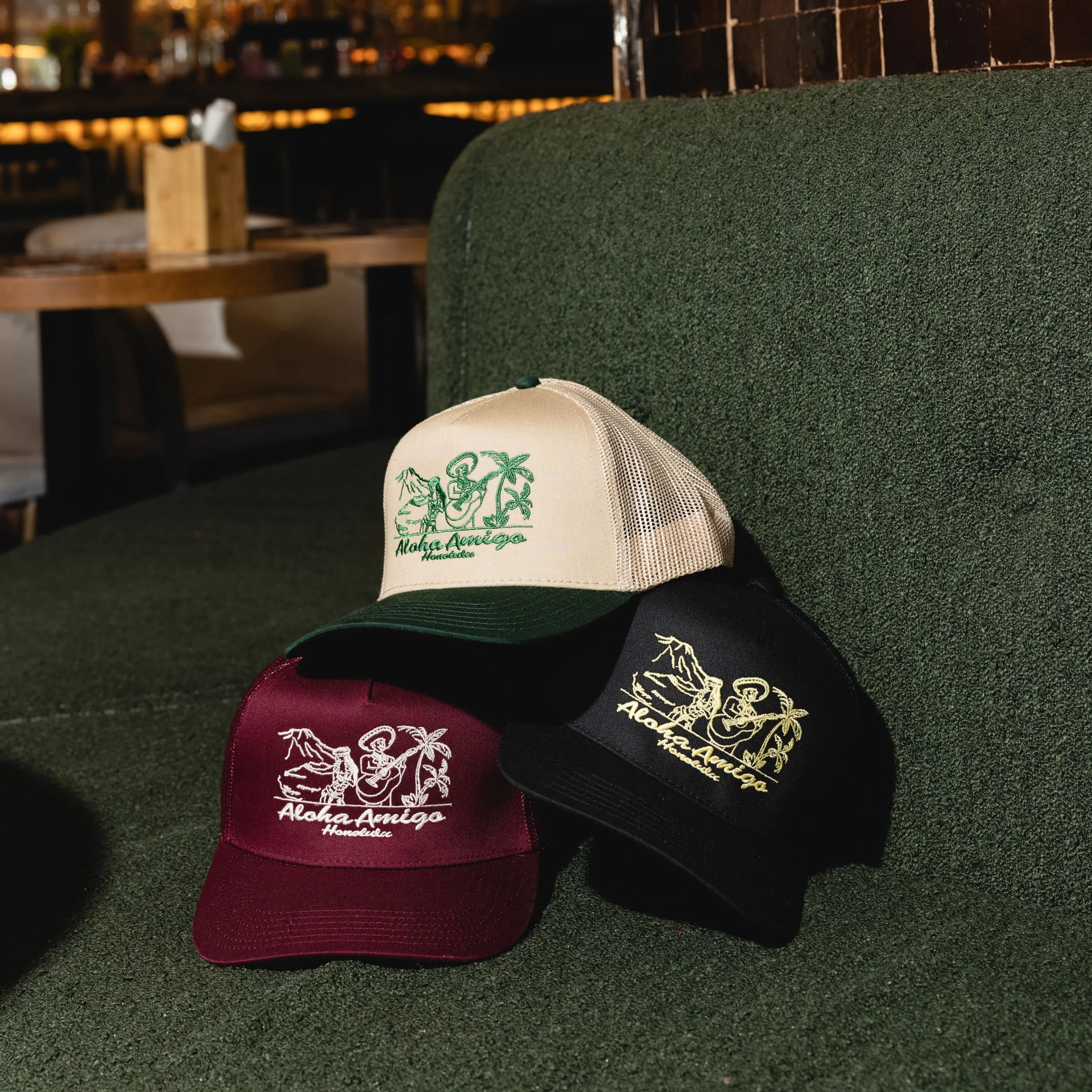 [Hula & Mariachi Mesh Back Trucker Cap]
Black · Khaki · Maroon
$35