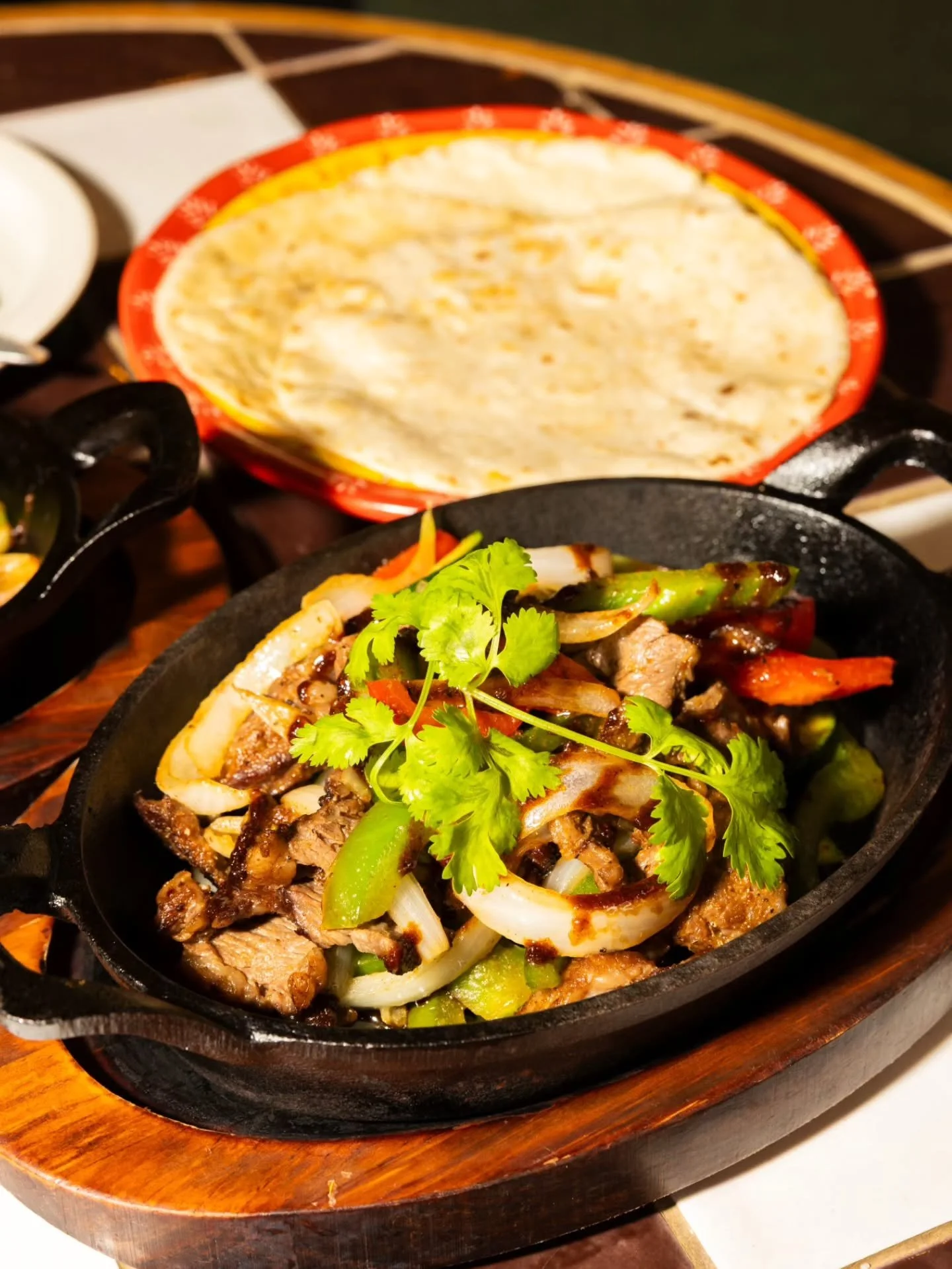Grilled steak, juicy shrimp, or tender chicken, served fajita-style with saut&eacute;ed peppers, onions, and warm tortillas! 🔥🌮 Every bite brings together bold flavors and fresh-off-the-skillet goodness.