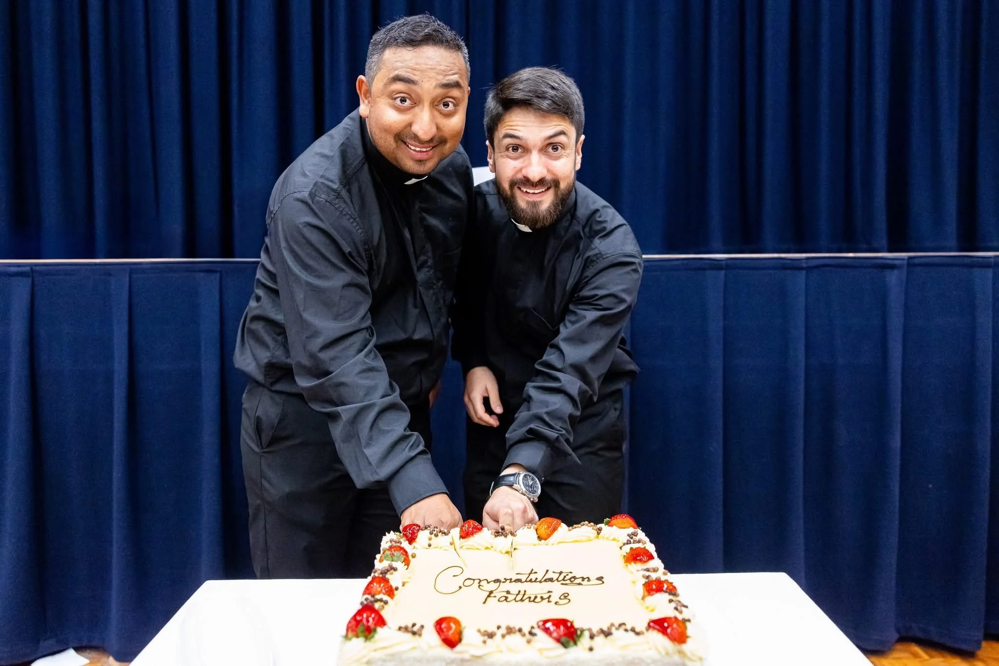Fr. Jorge & Fr. Giovanni cut the cake.jpeg