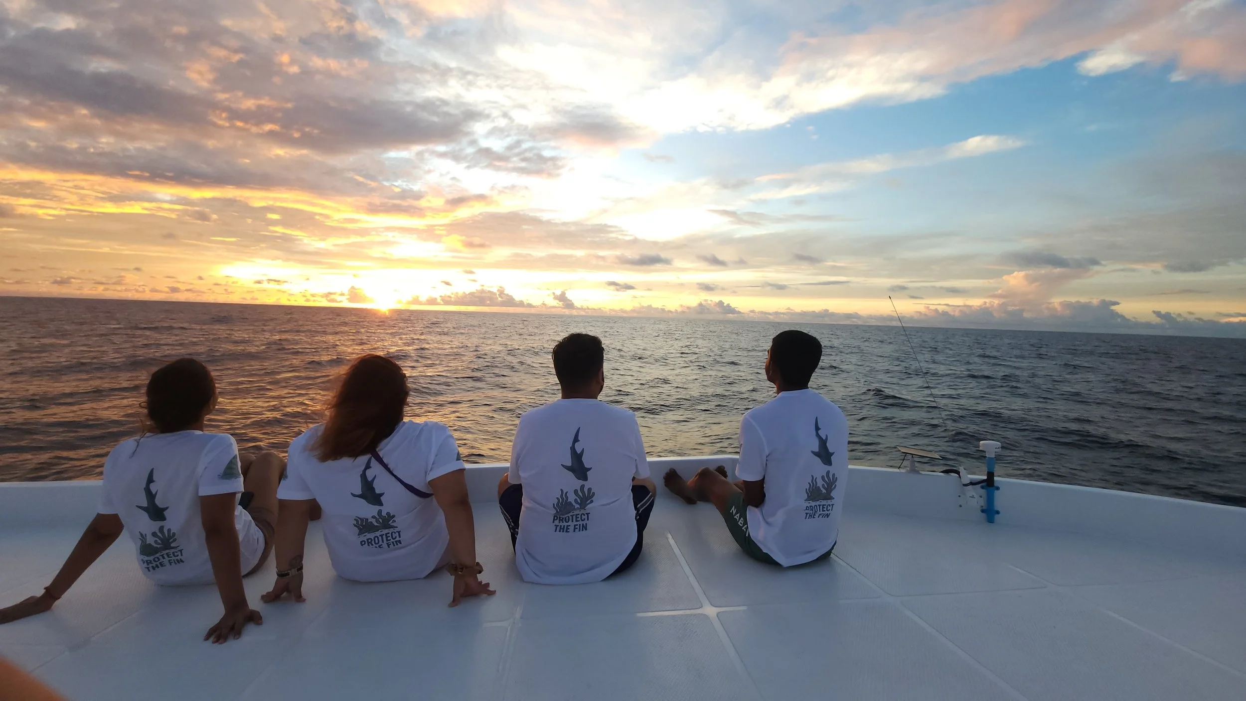 Group watching the sunset from the boat, Fuvahmulah