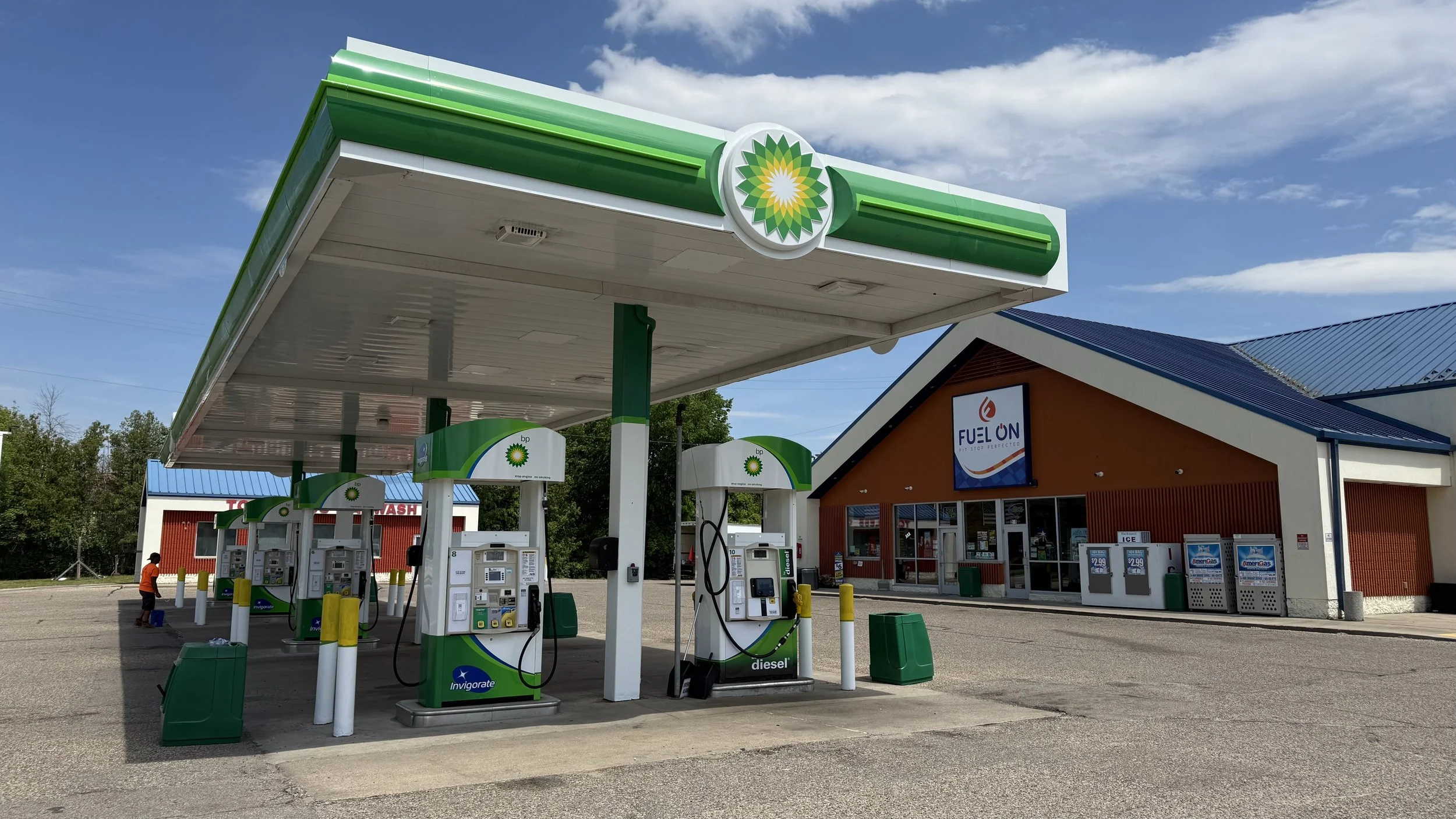 The Fuel On convenience store at 201 Clark Street, Stevens Point, Wisconsin, sits behind a BP branded canopy and pumps, with a car wash in the background.