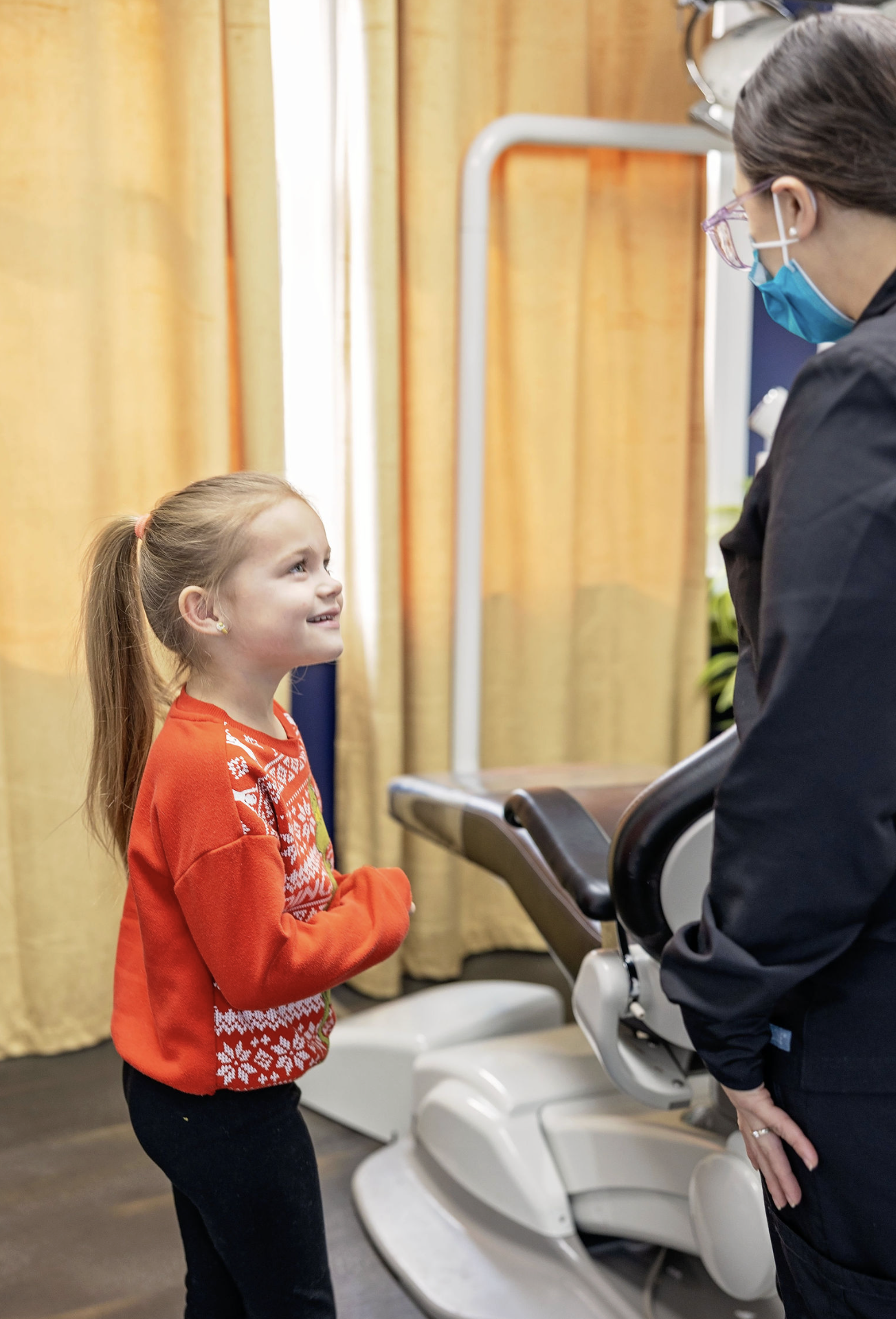 Patient at practice smiling after a visit with the dentist