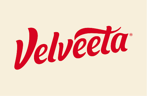 Velveeta logo in red script font on a beige background.