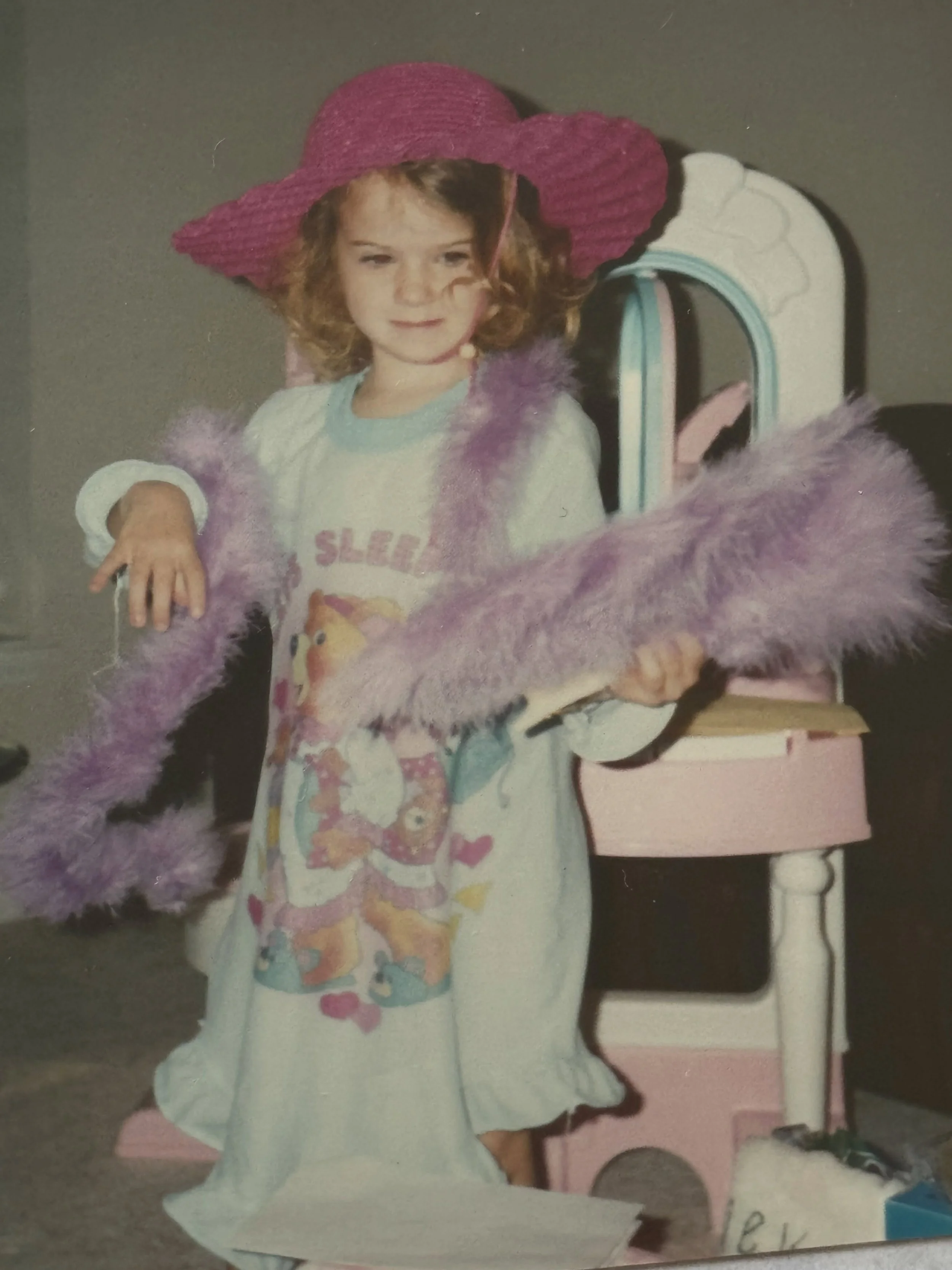 One of my favorite things about kids is how little they care what anyone thinks. A nightgown, a giant hat, and a feather boa? Perfect outfit. 

#childhoodmemories #childhoodcore #grandmoments