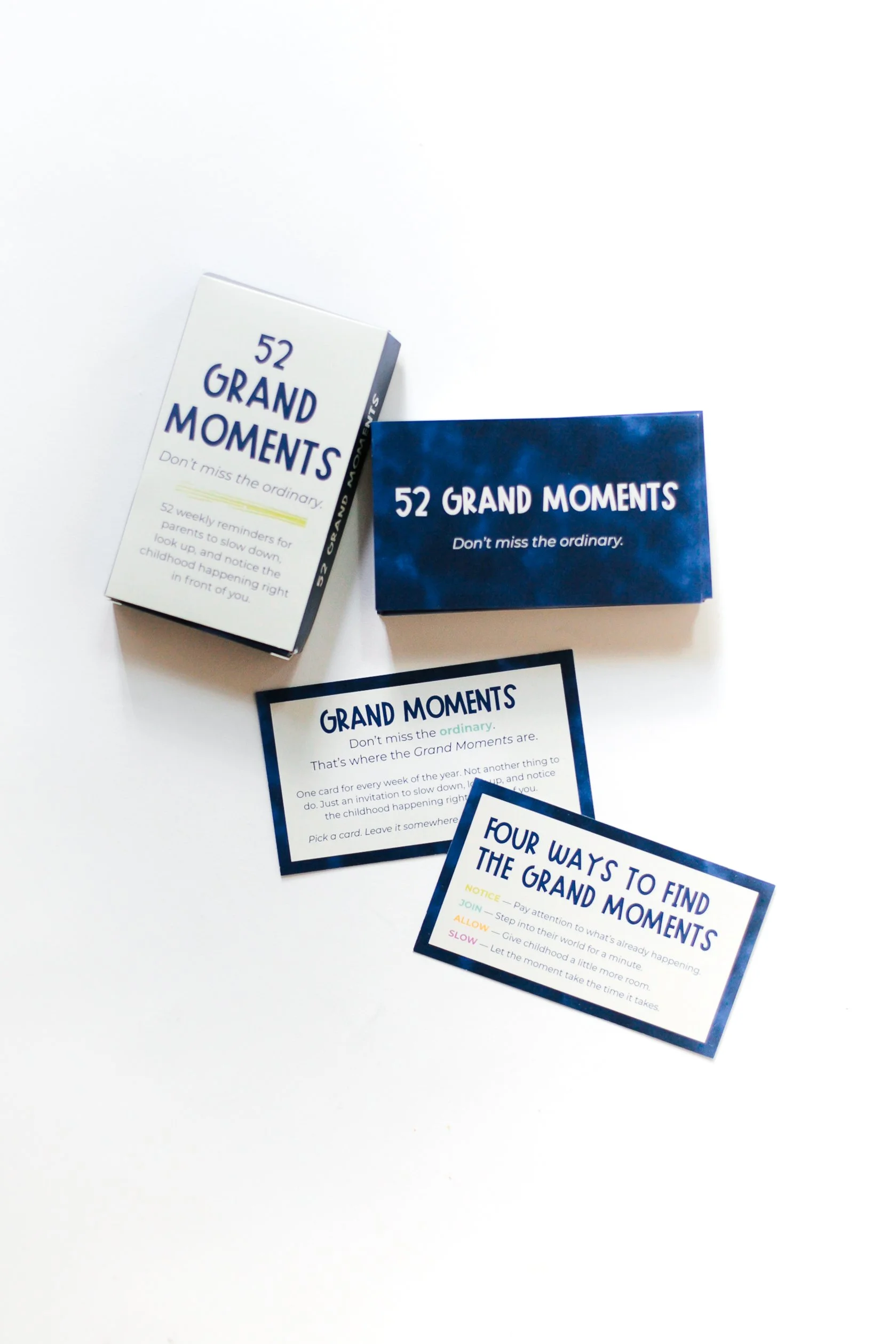 Open 52 Grand Moments card deck showing the cards and navy packaging.