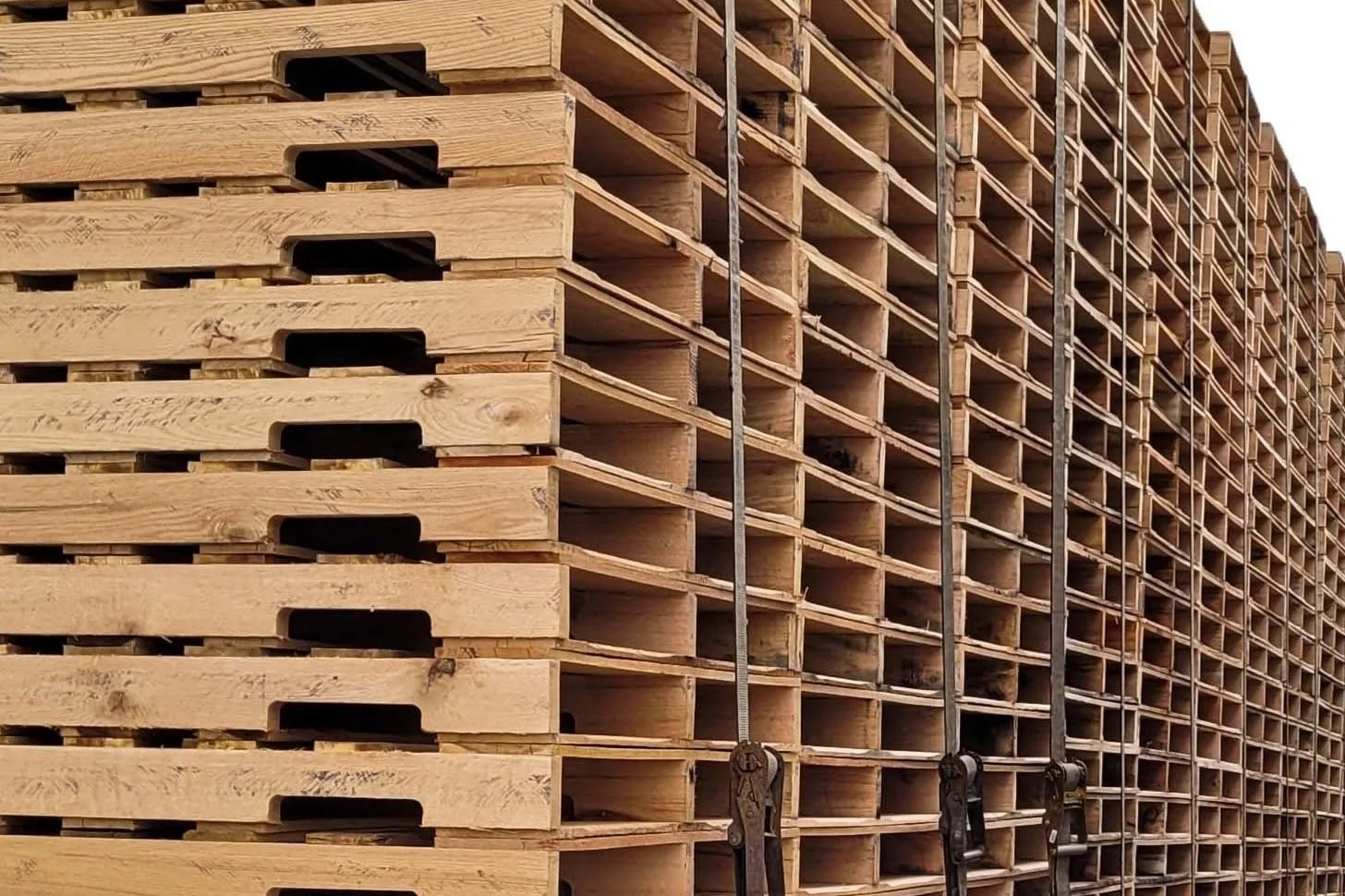 Lad of wood pallets tied down on a trailer