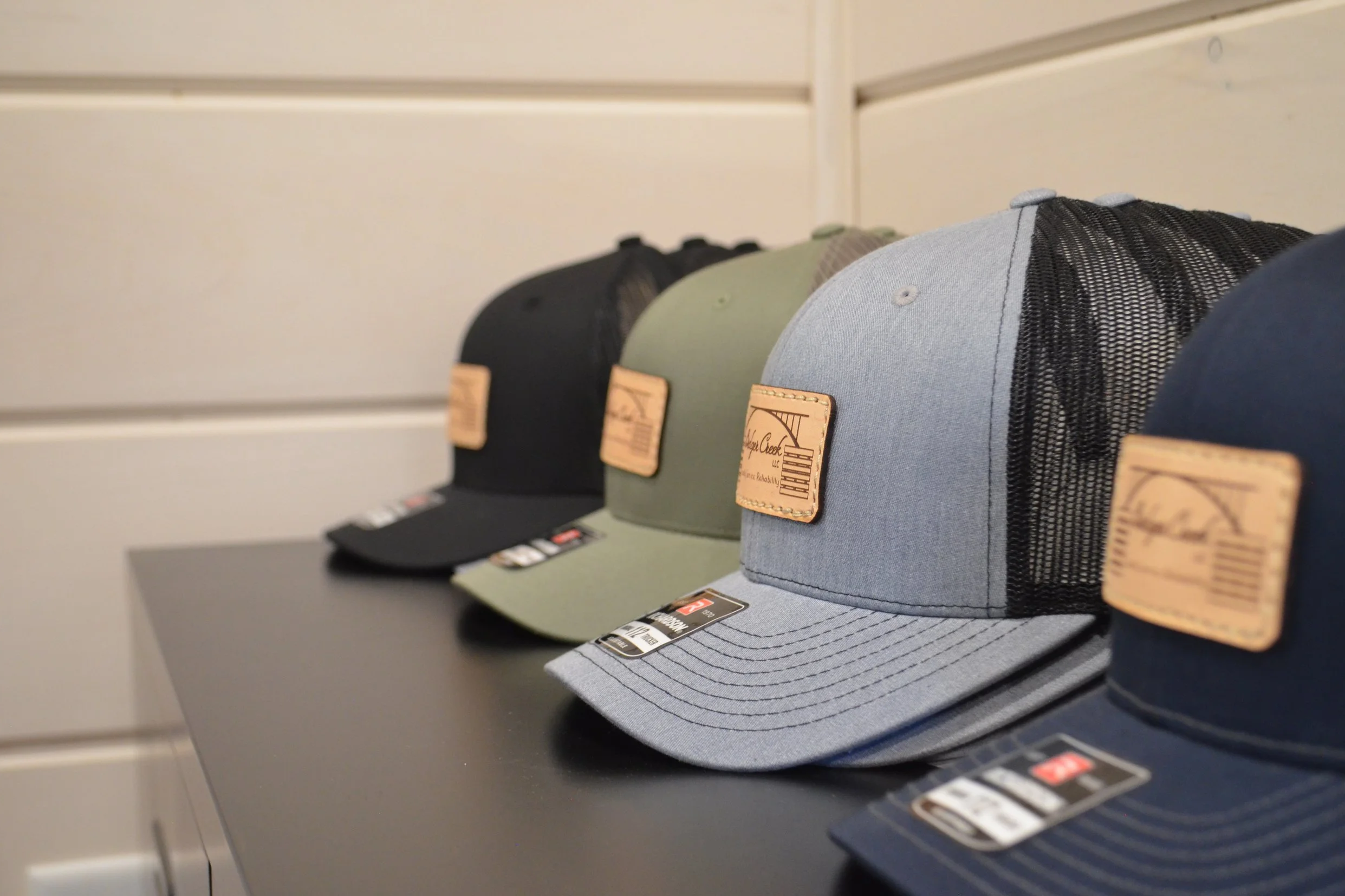 4 stacks of Bridger Creek hats