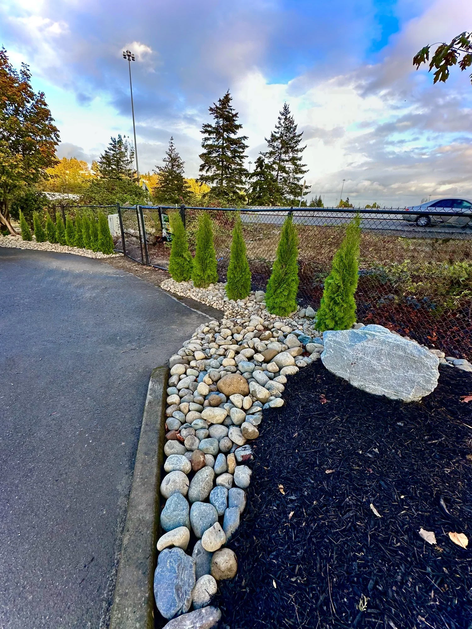 22-buckley-landscaped-entry-rock-border.jpg