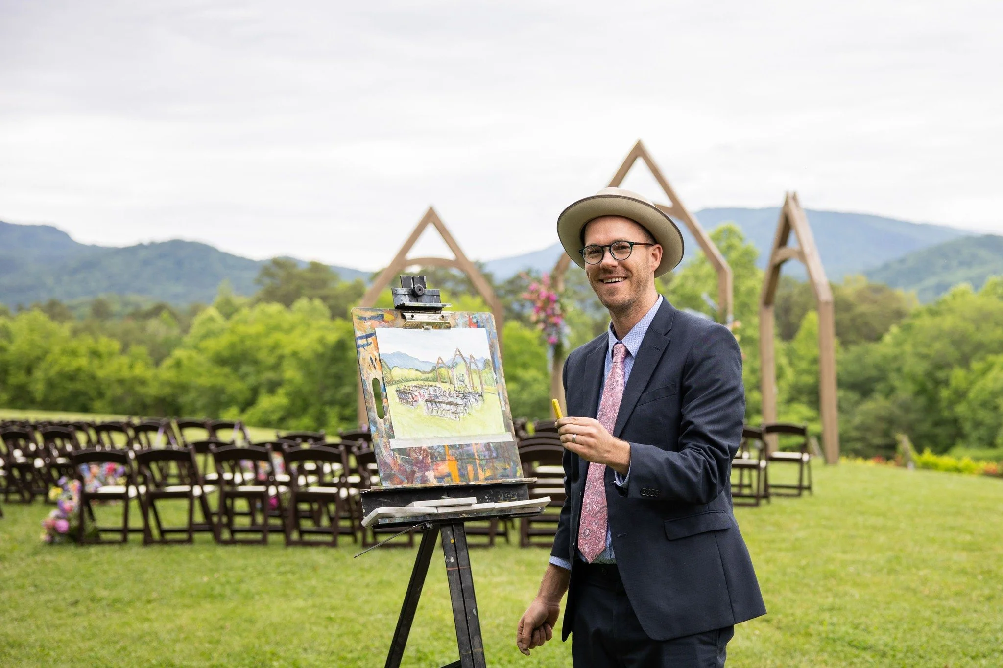 Collin Cessna painting "pleinair style" at an event. Collin Cessna will be leading a Workshop & Talk during the exhibition on Saturday, June 13, 2026, | 12-2pm "Intro to Casein Painting" Workshop by Collin Cessna. Followed by an Artist Talk at 3:30pm
