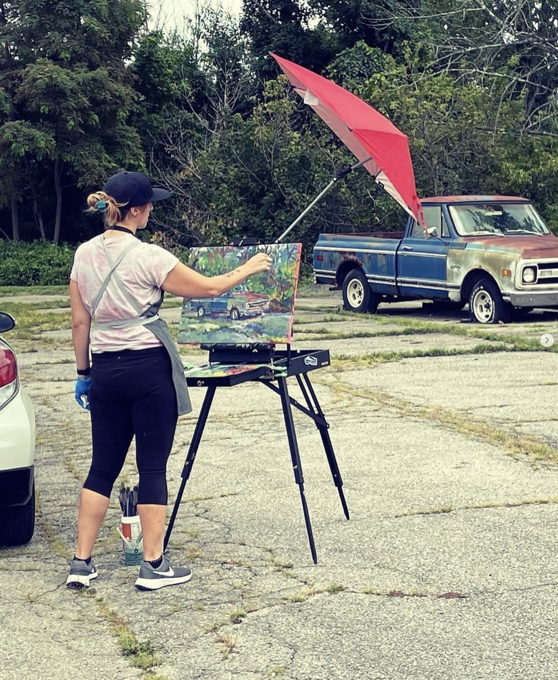 Beth-Ann Wilson painting in Floyd, VA at the "Floyd Plein Air Biennial" in 2024. Photo by Joli Ayn Wood. Beth-Ann will be giving a painting demo with blacklight paint and an Artist Talk during the show on Thursday, May 7, 2026 from 5:30 PM  7:30 PM a