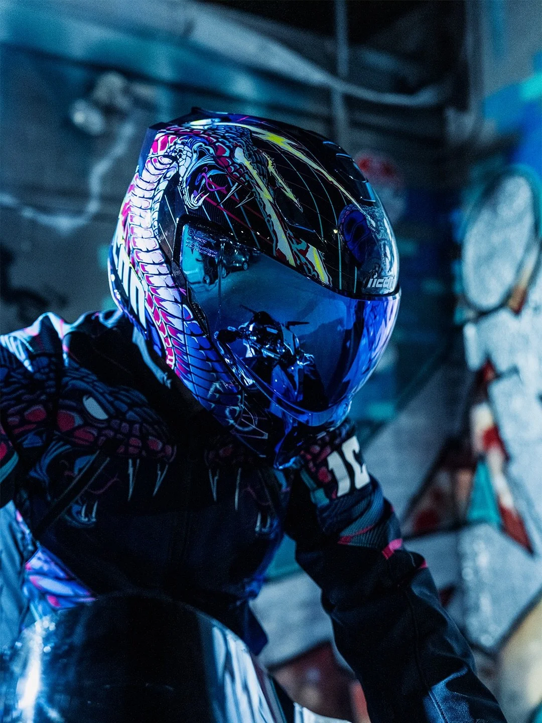 Strike like lightning. The Threshold Lazer Cobra emerges from the urban haze as a serpent of pure energy, its gaze domineering everything in its path. 

Available now at authorized ICON dealers.