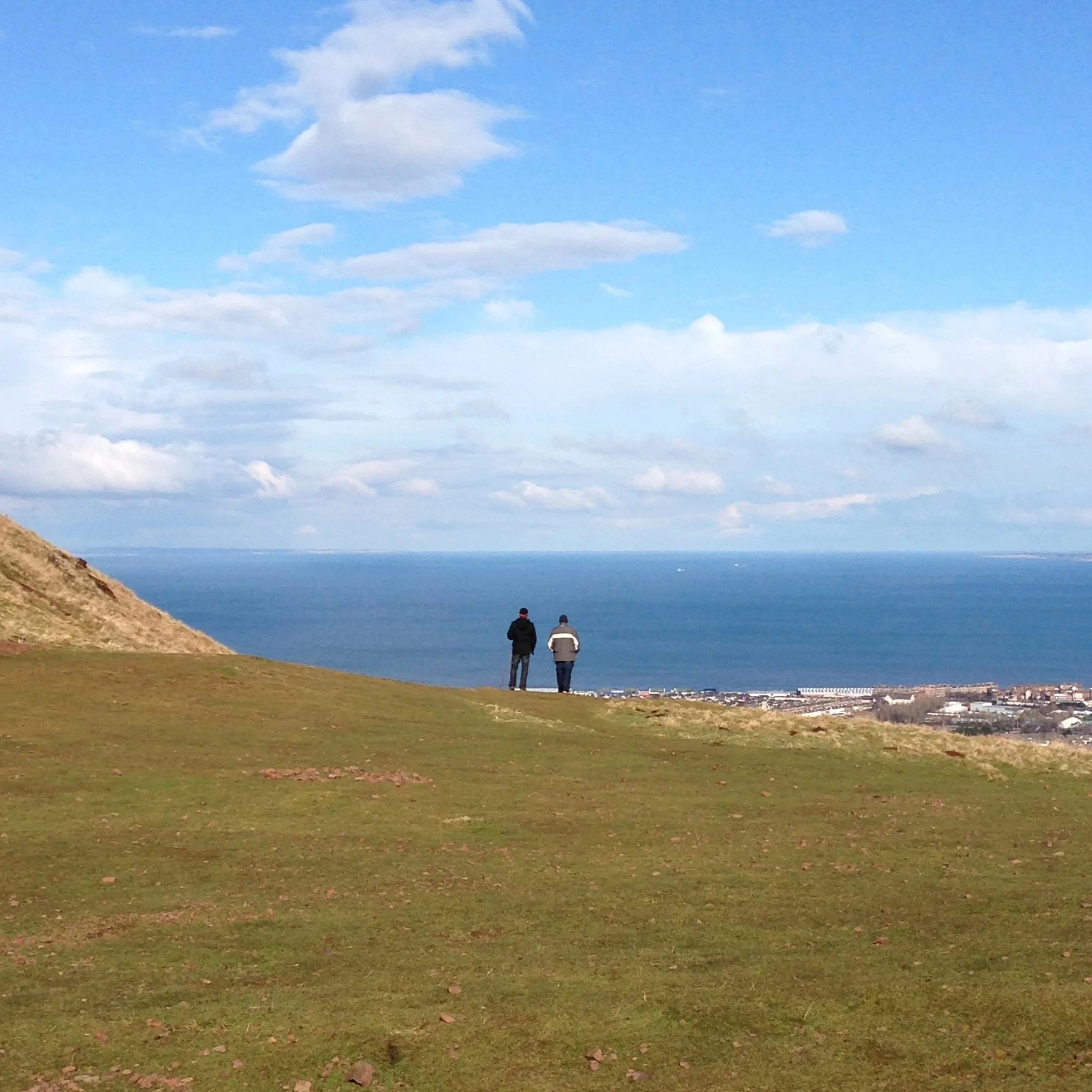 Two people looking out at a horizon, symbolizing leadership vision and the journey of Christian leadership coaching with Shawn Grant.