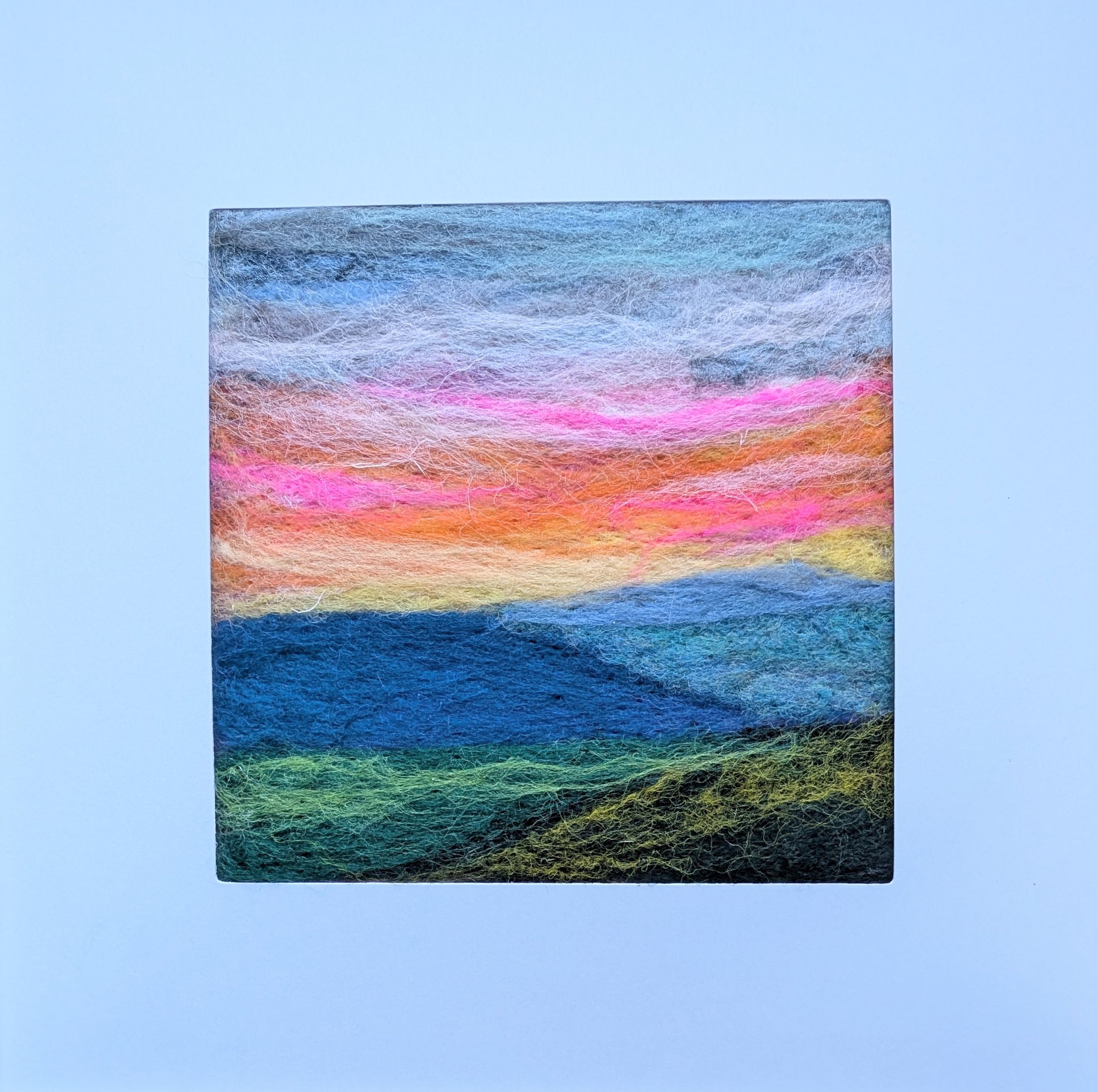 Vibrant Sky 2
5x5"
wool on felt
white mat and frame, thrifted