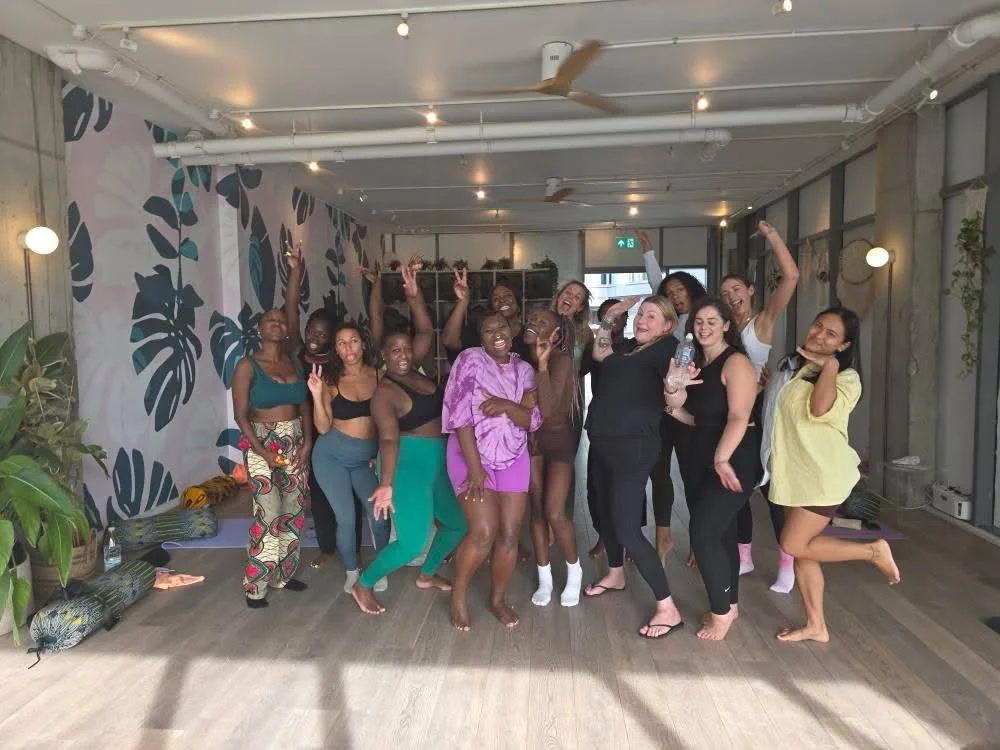 Body Wizdom Workshop, group of women standing together laughing and posing for a picture