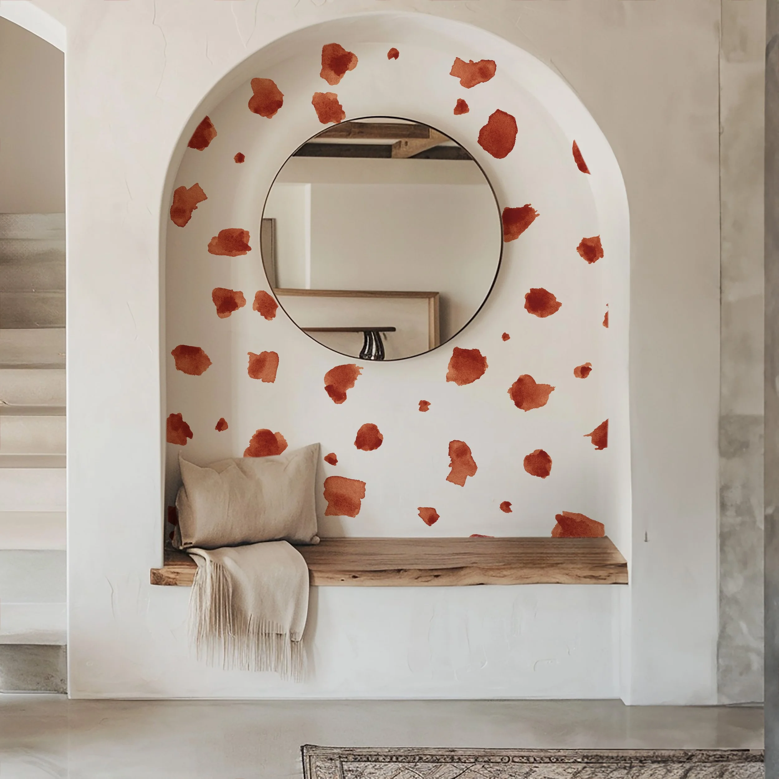 Minimalist design, boho entryway with a large scale printed wall covering in an abstract, watercolor, brush stroke pattern in rust color.