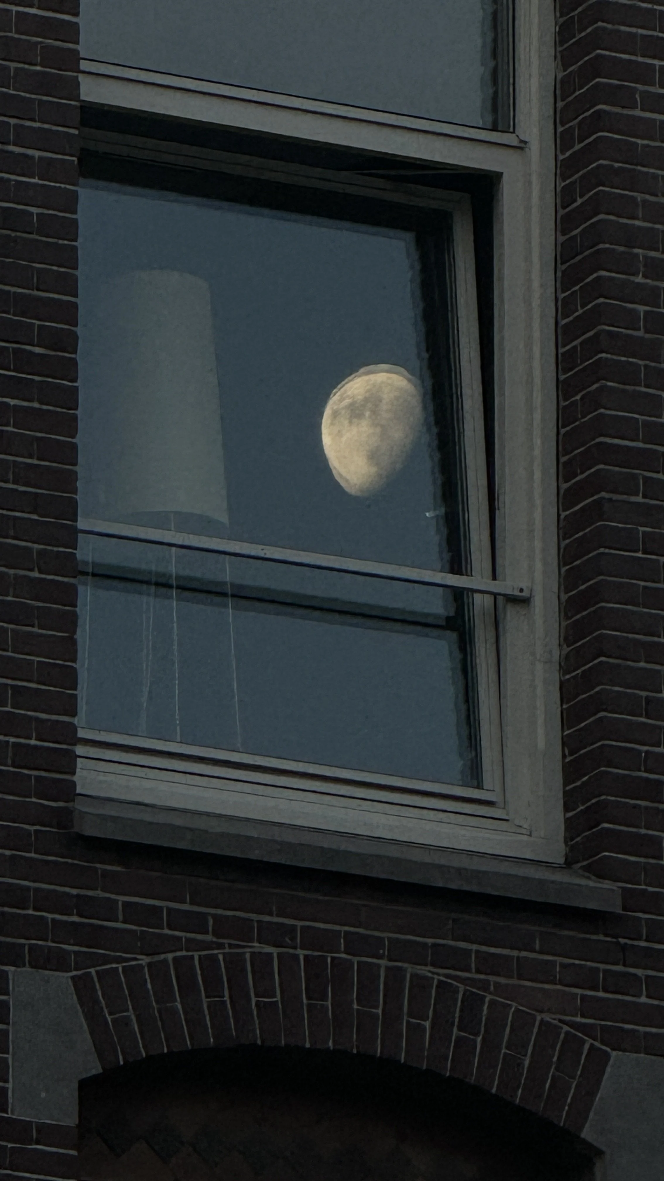 Close-up of a dark stone archway with aged brick detail, moody atmospheric texture