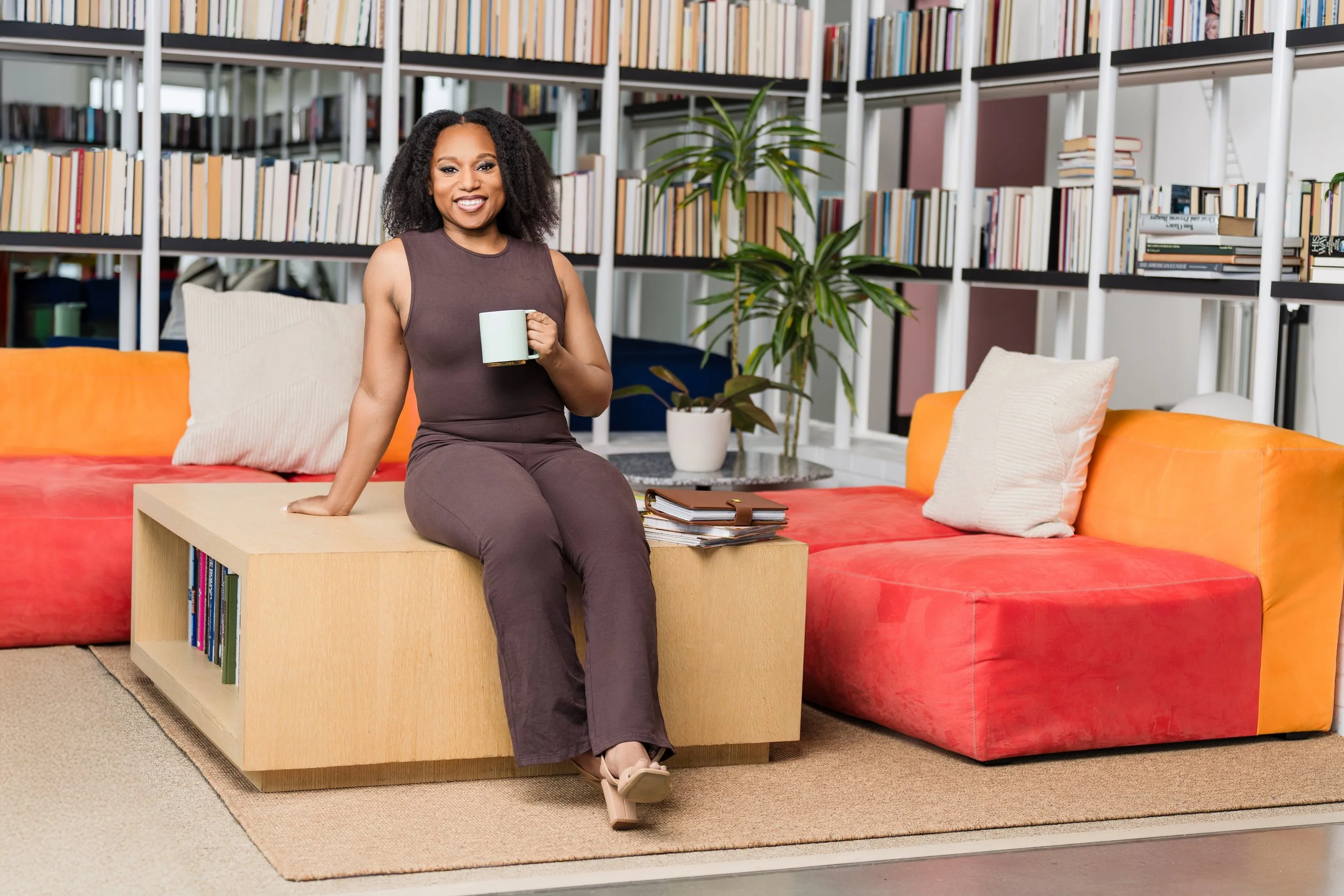 Therapist and coach Meagé in a welcoming office space, offering trauma-informed care