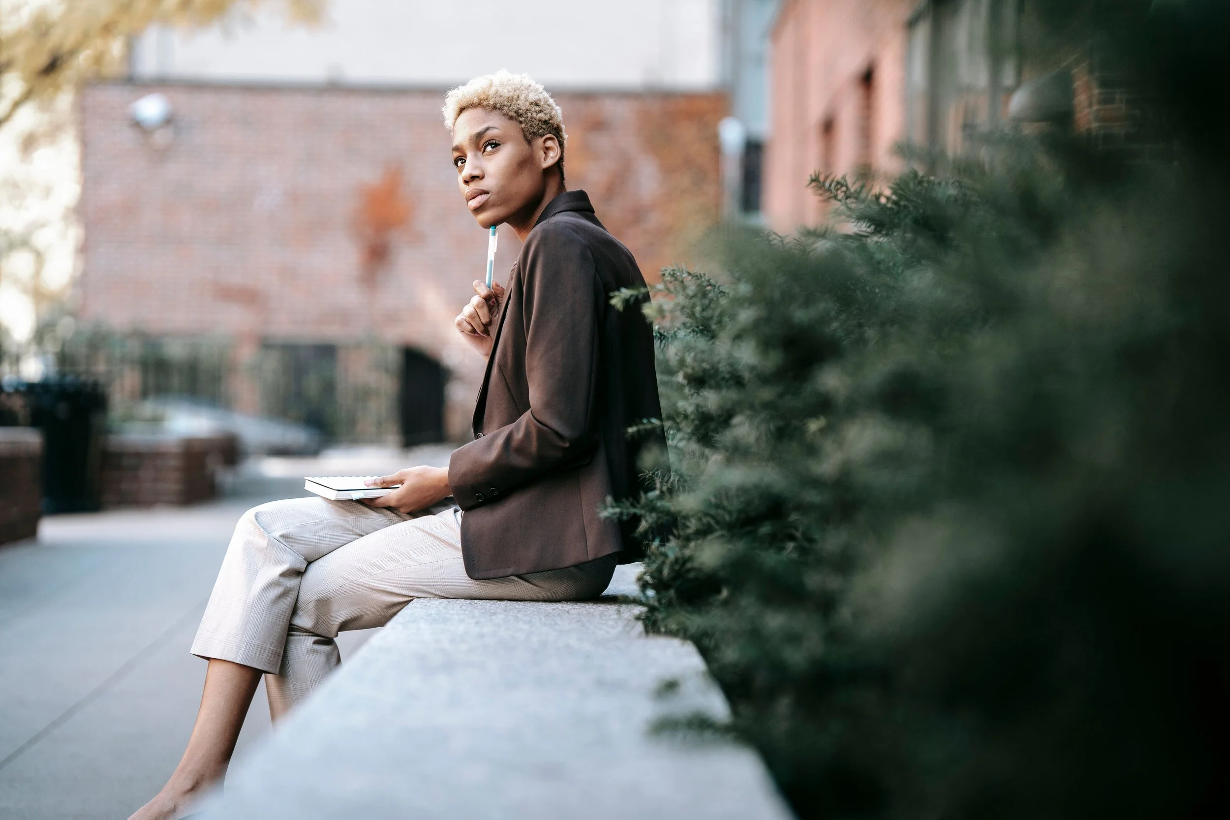 Woman sitting thoughtfully representing attachment-based therapy for relationship patterns and trauma in Maryland