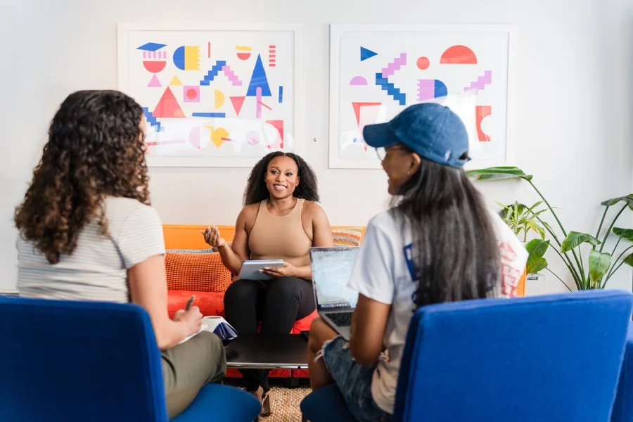 Meagé facilitating a trauma-informed group session during a wellness workshop in Gaithersburg, MD