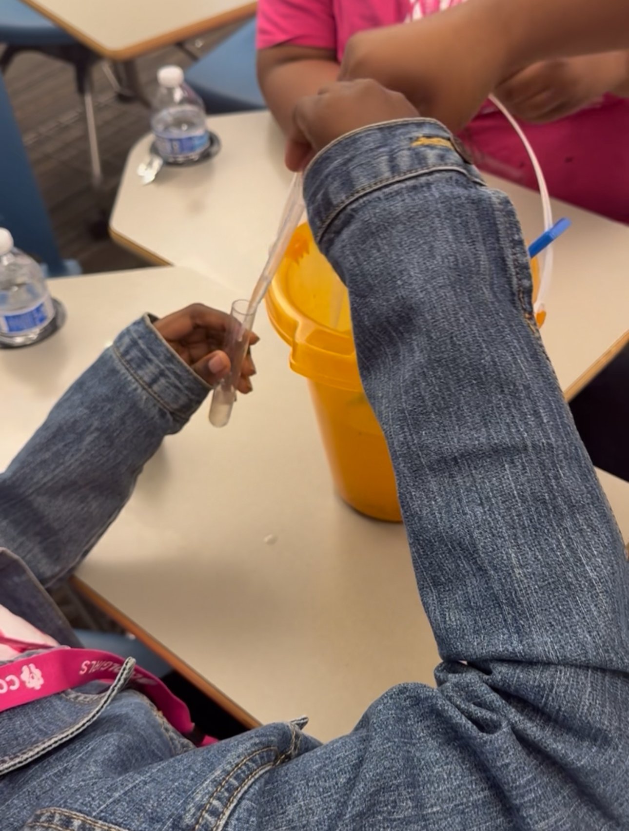 Using pipet to put water solution into test tube